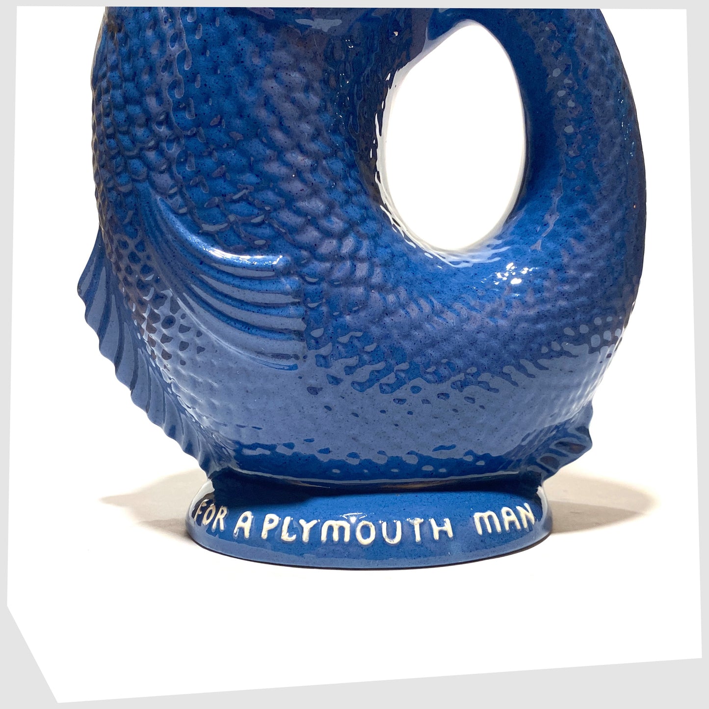 Original Dartmouth Pottery Gluggle Jug in blue glaze with "for a Plymouth man' on the base rim