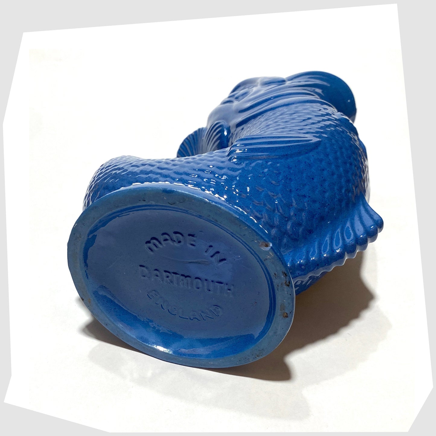 base of the Plymouth Gin Dartmouth Pottery Gluggle Jug in blue glaze with "for a Plymouth man' on the base rim