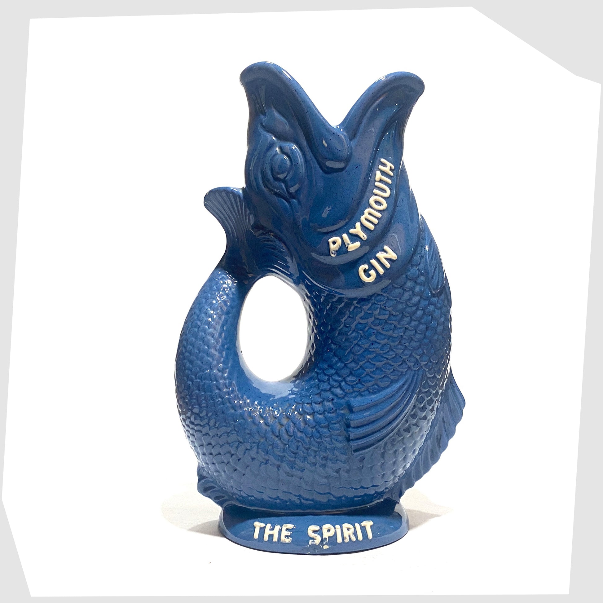 Dartmouth Pottery Plymouth Gin Gluggle in a sea blue glaze with white text around the spout and base