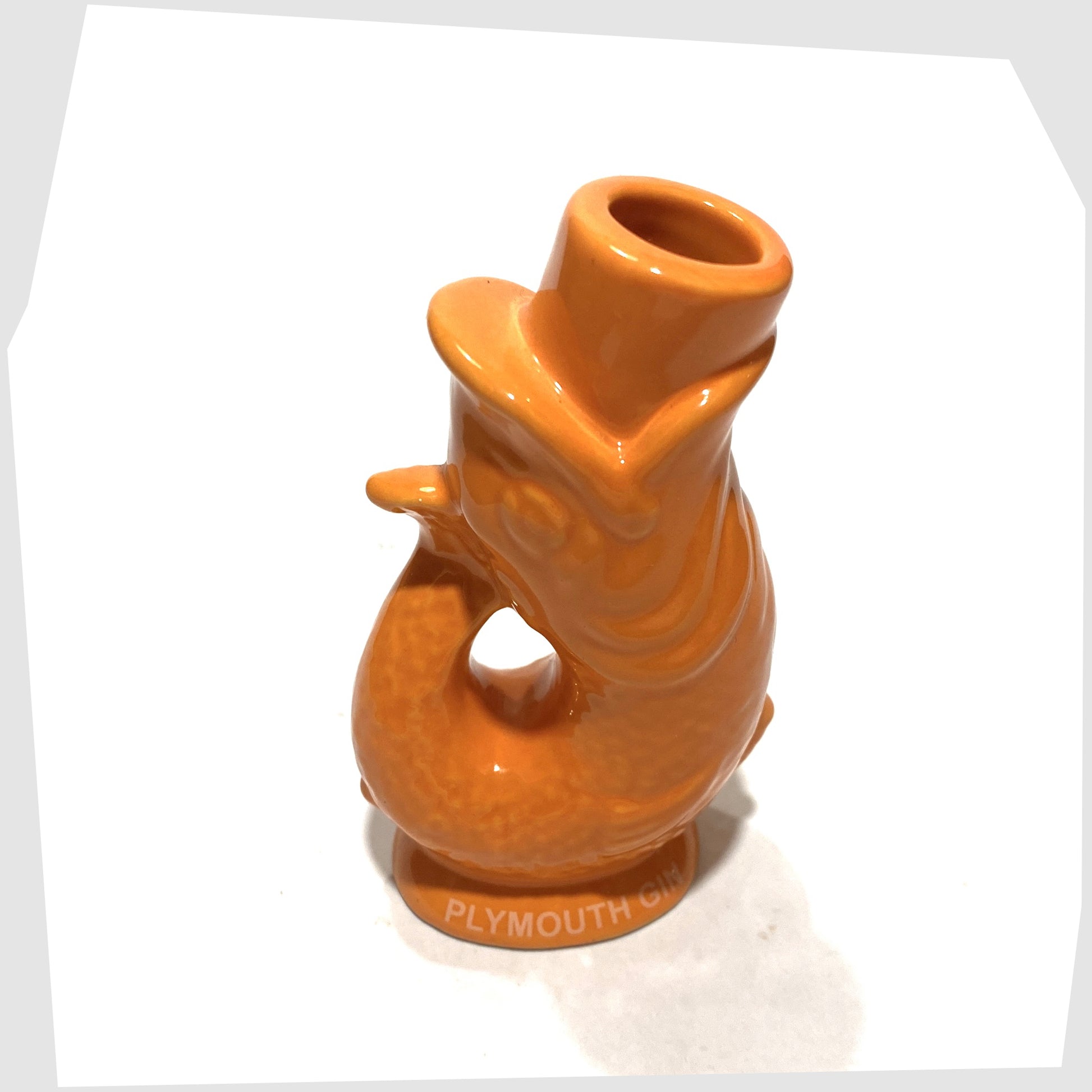 spout on the mini gluggle jug in orange glaze with plymouth gin text around the base rim