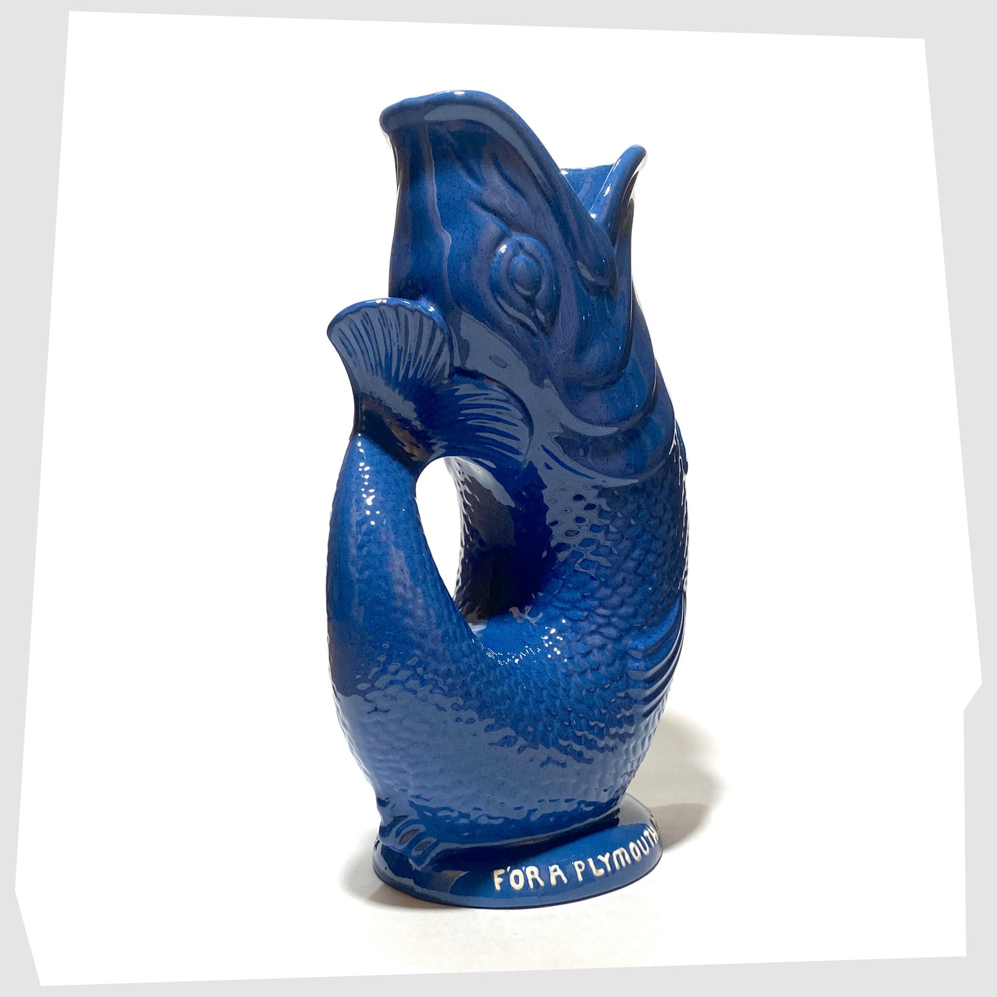 tail of the original Dartmouth Pottery Gluggle Jug in blue glaze with "for a Plymouth man' on the base rim