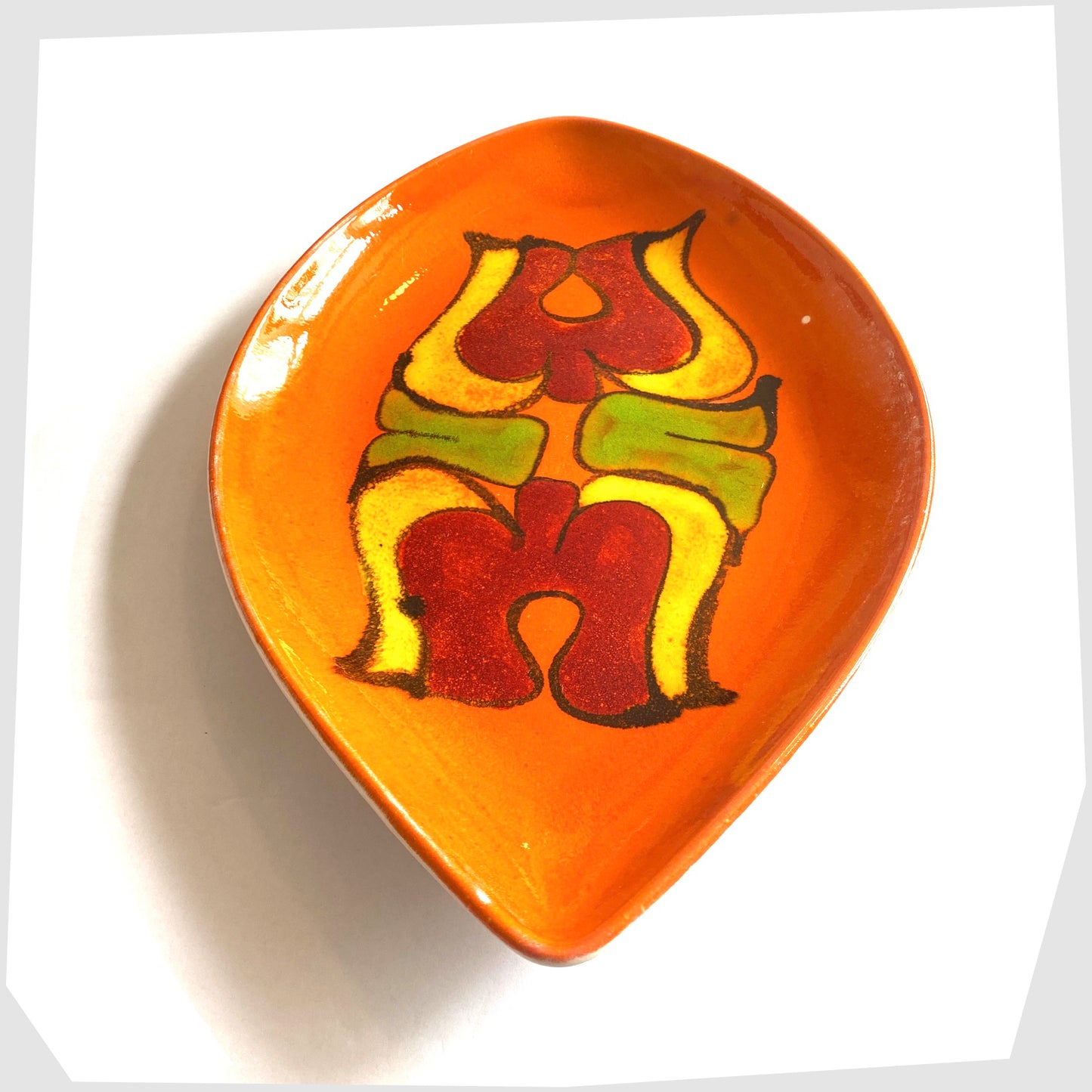 1960s poole pottery teardrop dish, decorated in an orange delphis glaze with fluid shapes of green, yellow and red