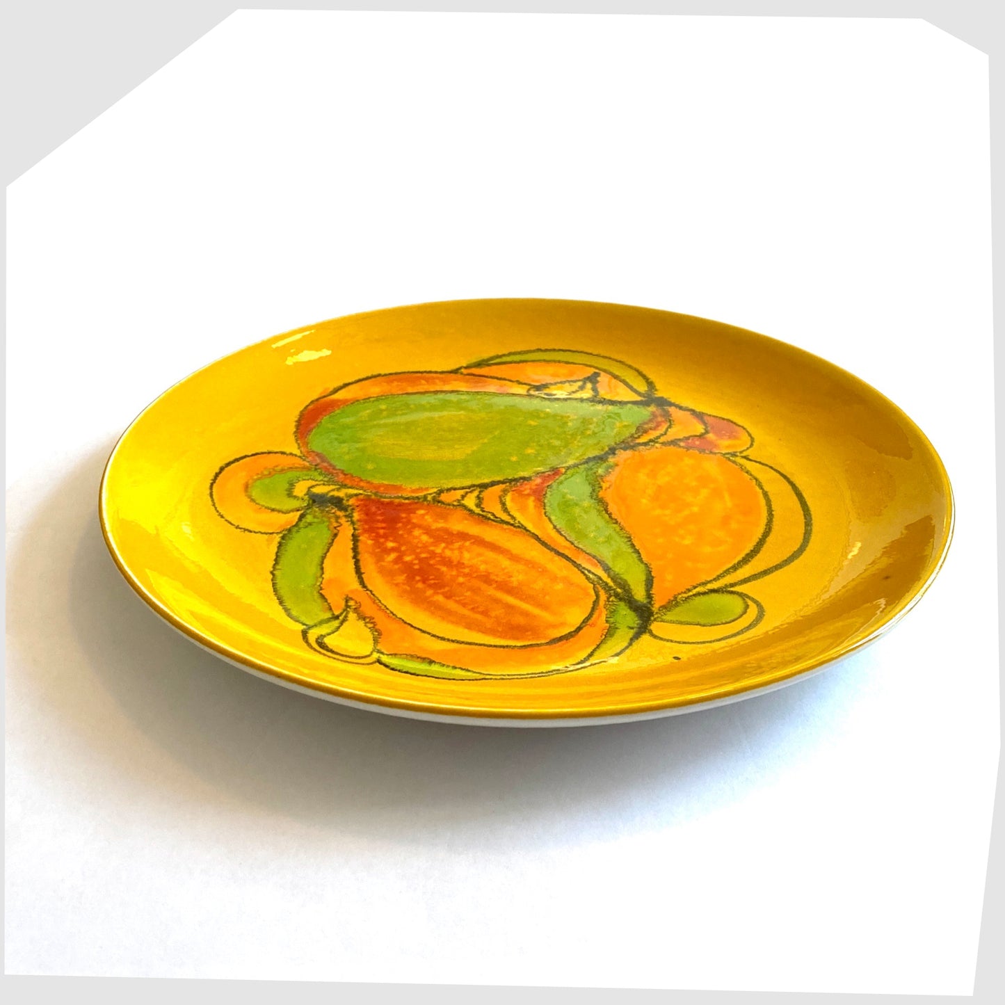 1960s Poole Pottery Delphis Plate, shape 4A, in a bold yellow glaze with flowing shapes of green, orange and red.