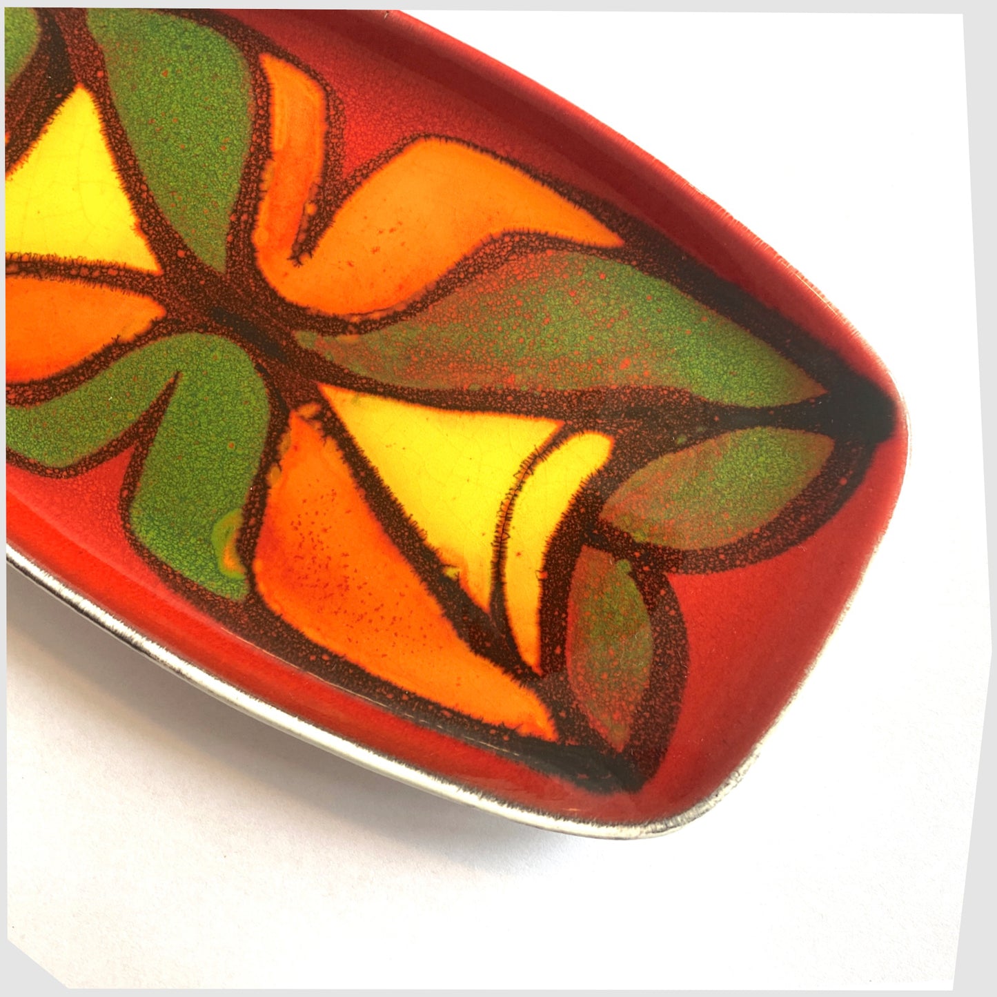 poole pottery decorative dish, glazed in the delphis pattern in vibrant red, green, yellow and orange