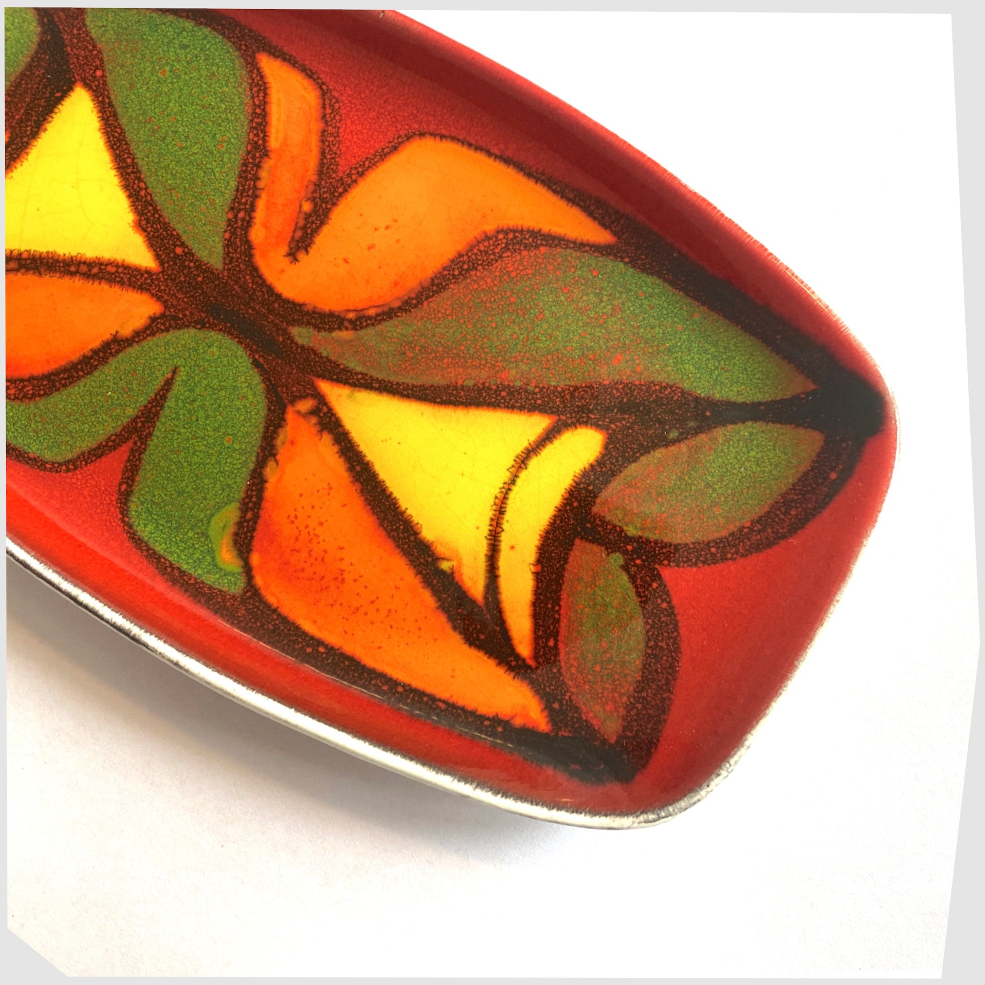 poole pottery decorative dish, glazed in the delphis pattern in vibrant red, green, yellow and orange