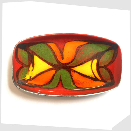decorative plate by poole pottery, glazed in the delphis pattern in vibrant red, green, yellow and orange