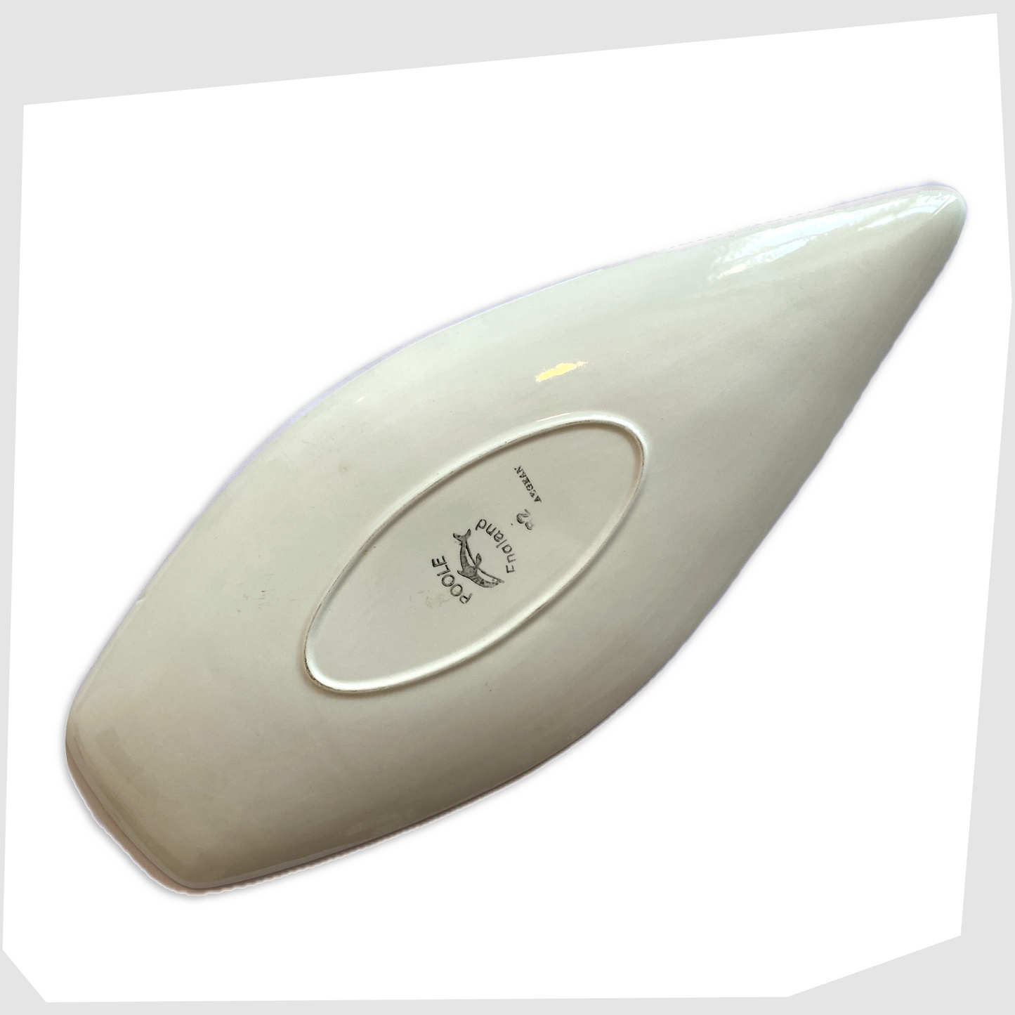 rear of the poole pottery aegean spear dish, shape 82, with fish design