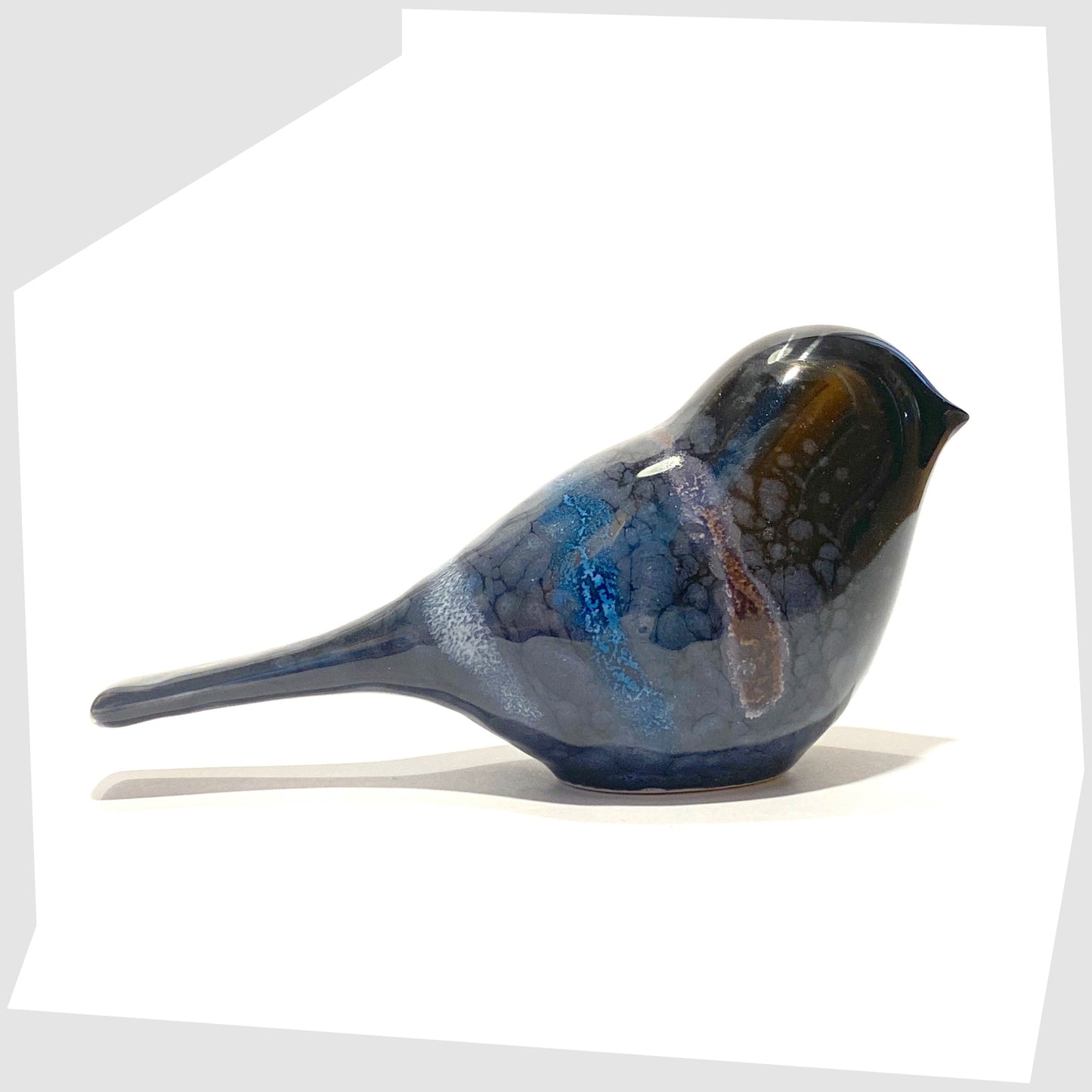 poole pottery ceramic bird ornament in celestial glaze of black with blue and purple tones