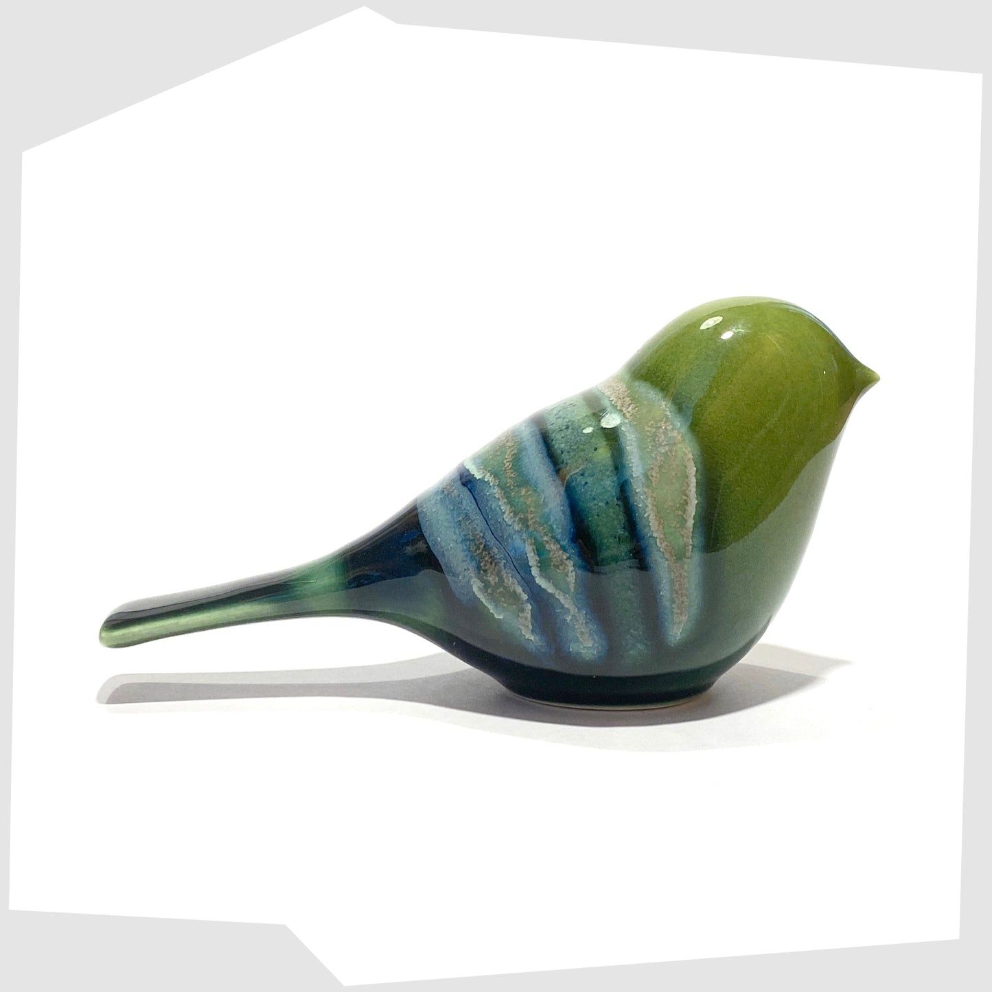 poole pottery perching bird ornament in maya glaze of green, blue and warm grey