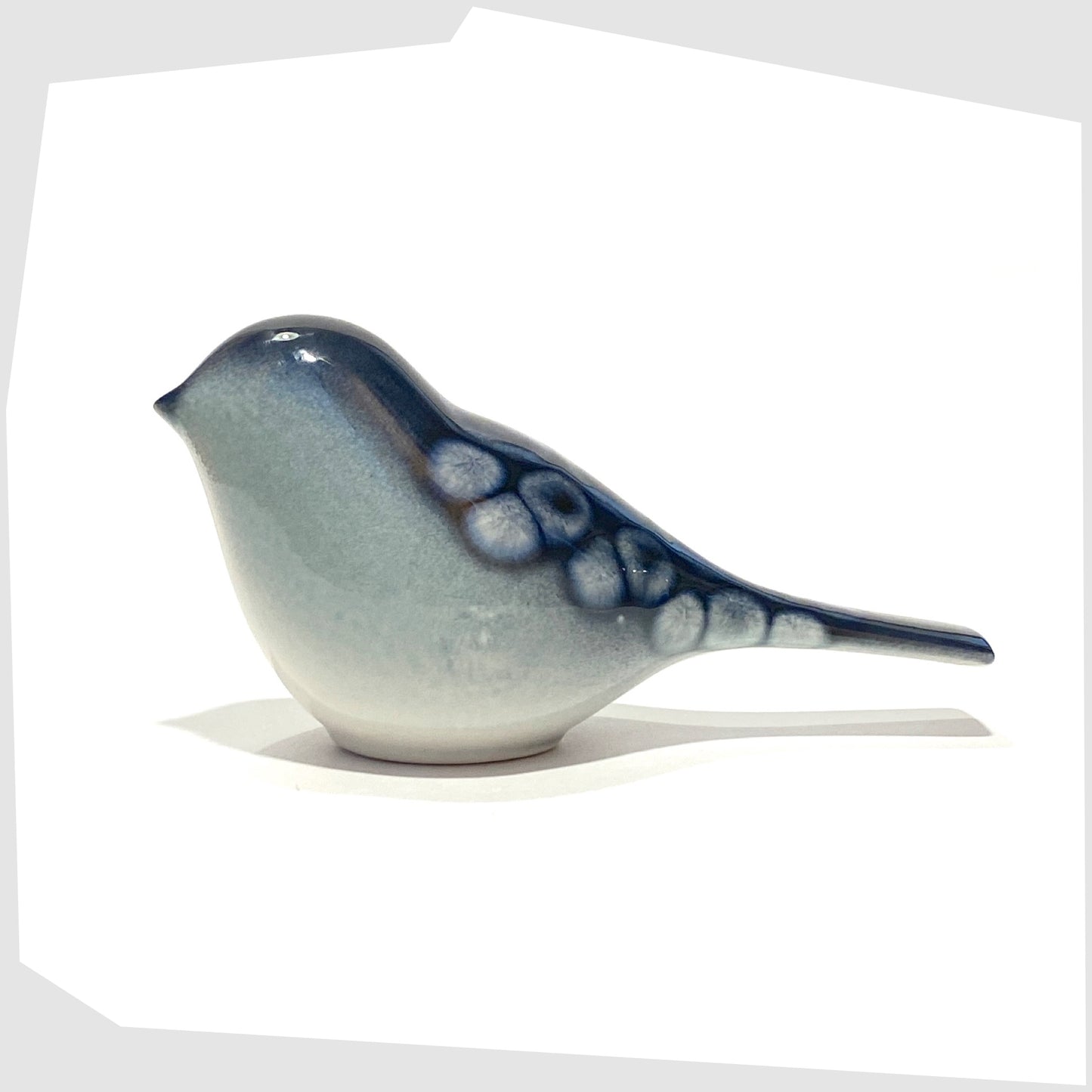 poole pottery perching bird ornament in ocean glaze of blue with white circles