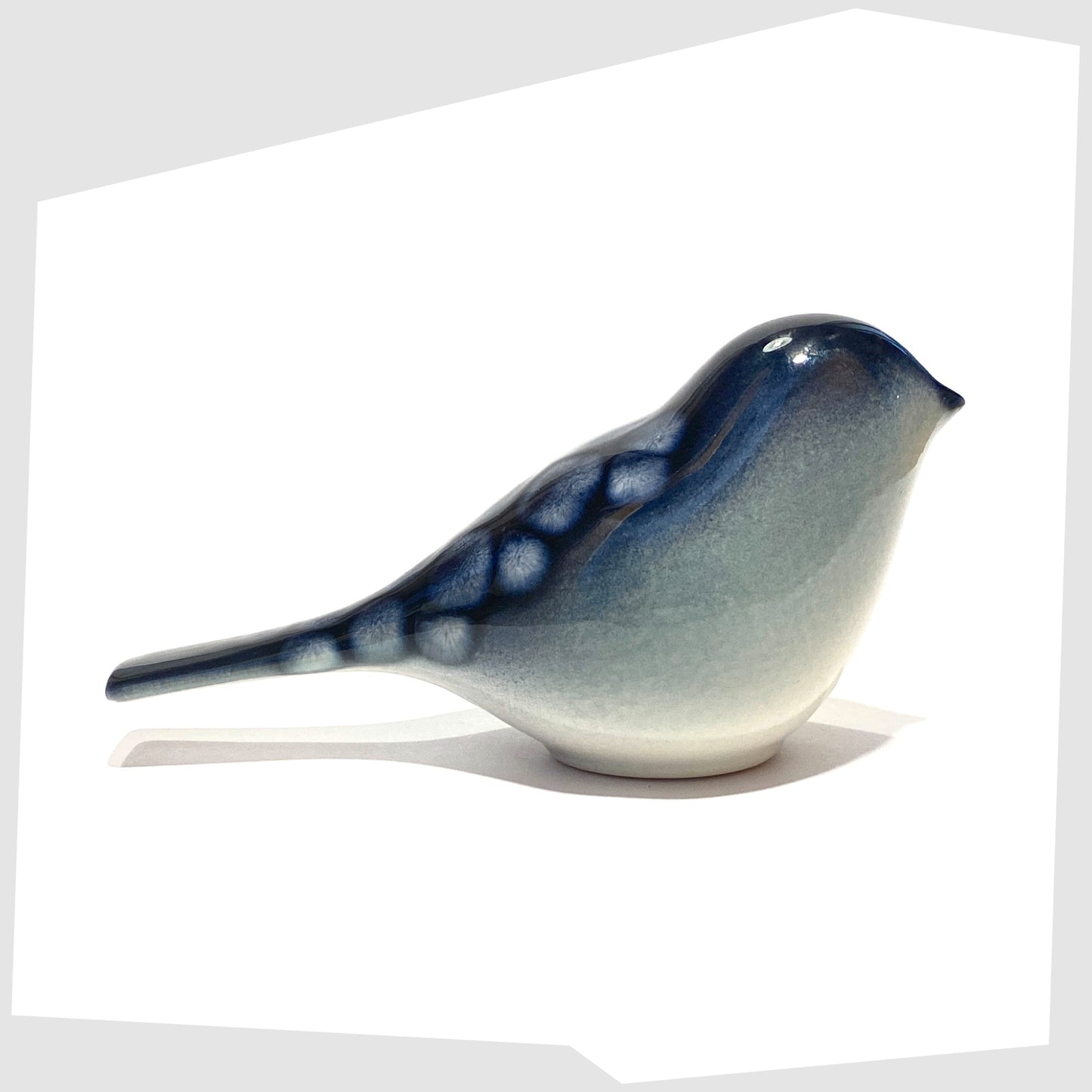 poole pottery perching bird ornament in ocean glaze of blue and white
