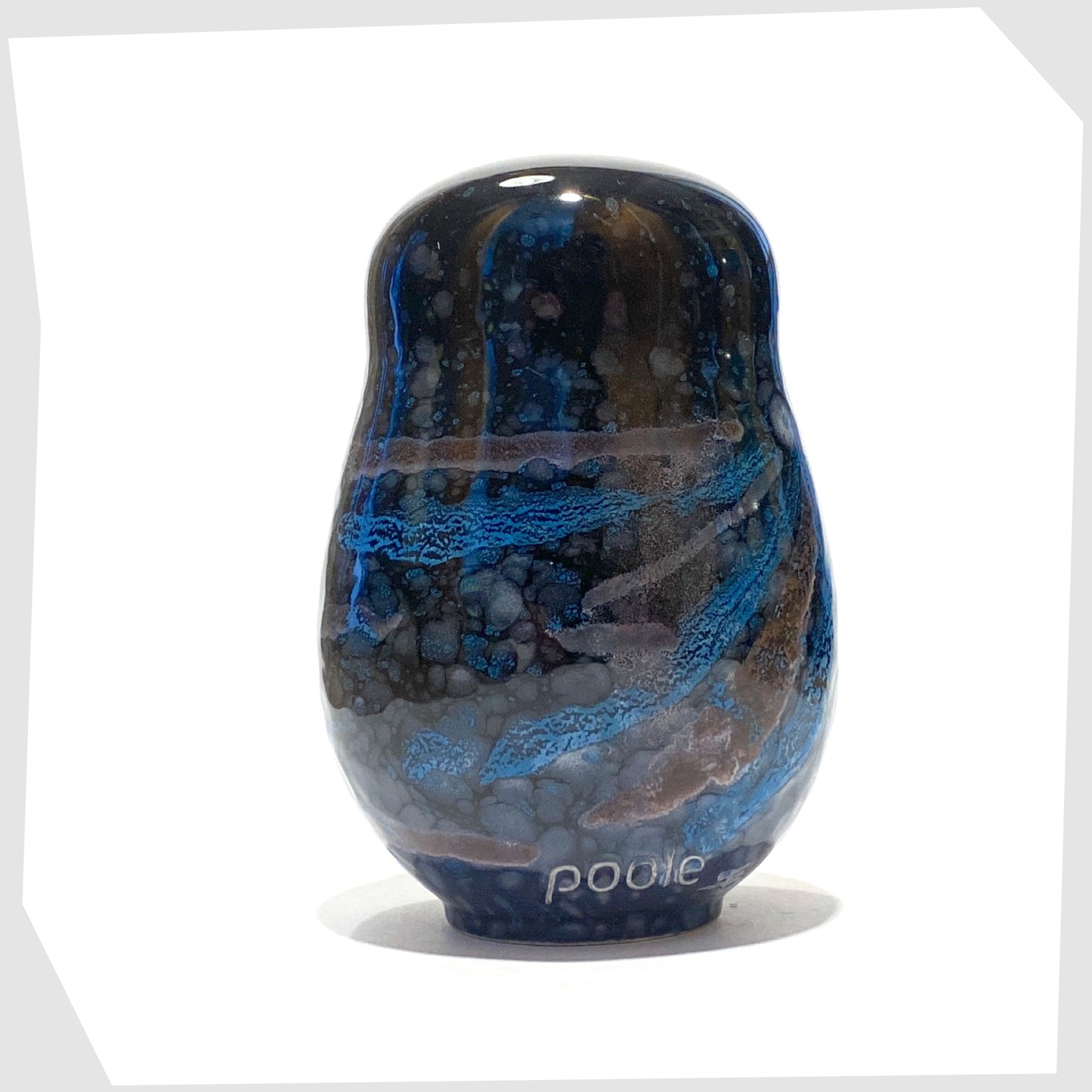 rear of the poole pottery large owl ornament glazed in the celestial finish of black, blue and violet