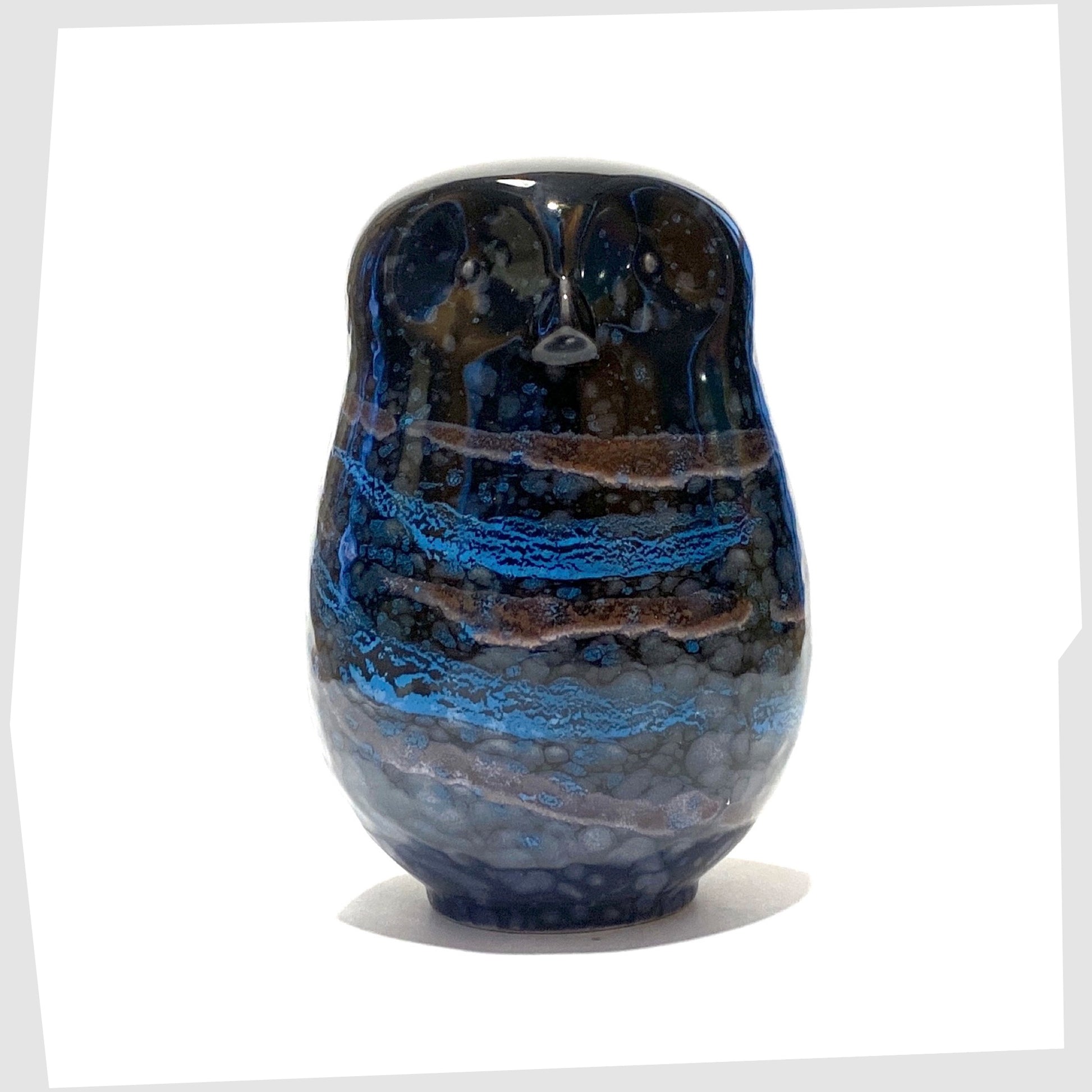 large poole pottery owl ornament glazed in the Celestial finish of black, blue and violet
