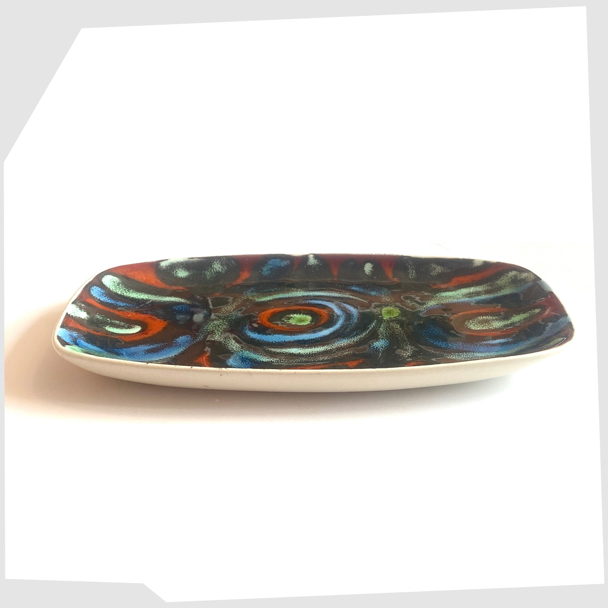 side profile of the Poole Pottery Delphis Dish, Shape 361, by Jean Millership in a striking multicoloured glaze of radiating lines