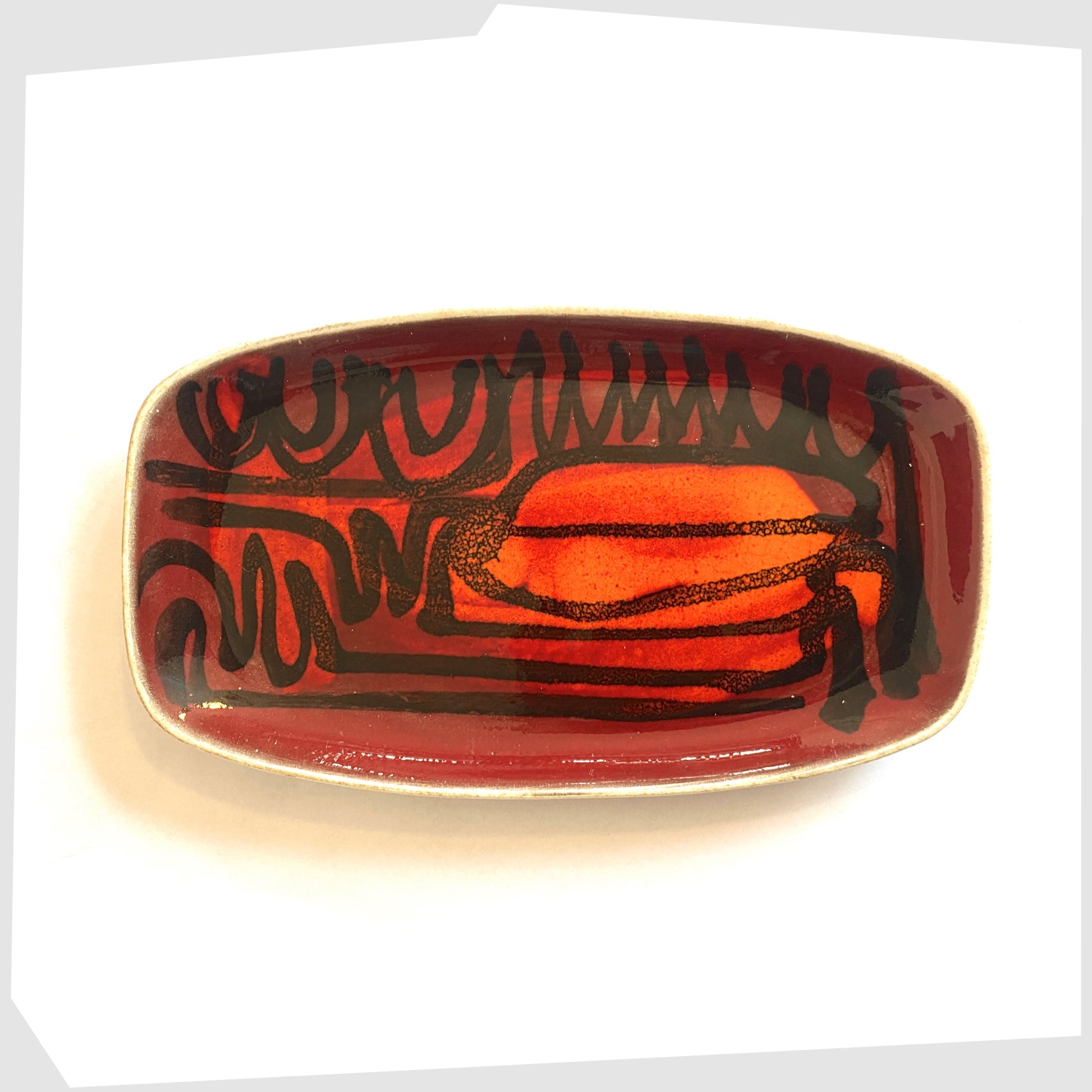 poole pottery delphis pin dish, shape 361, glazed in a rich red and orange glaze with black flowing lines