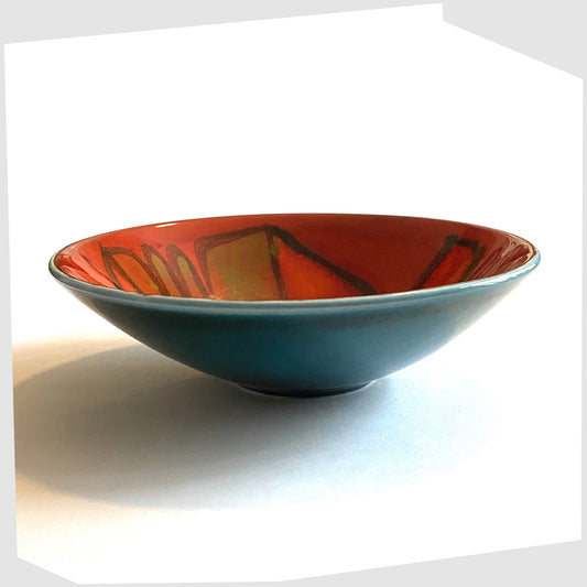Poole Pottery Shape 56 Bowl by Cynthia Bennett glazed in a red delphis glaze with teal exterior