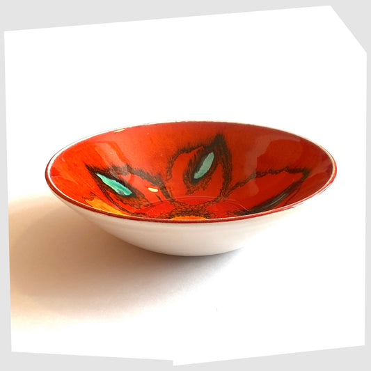 Poole Pottery Delphis Bowl, shape 56, by Mary Albon glazed in a vivid red with forms or turquoise blue and yellow