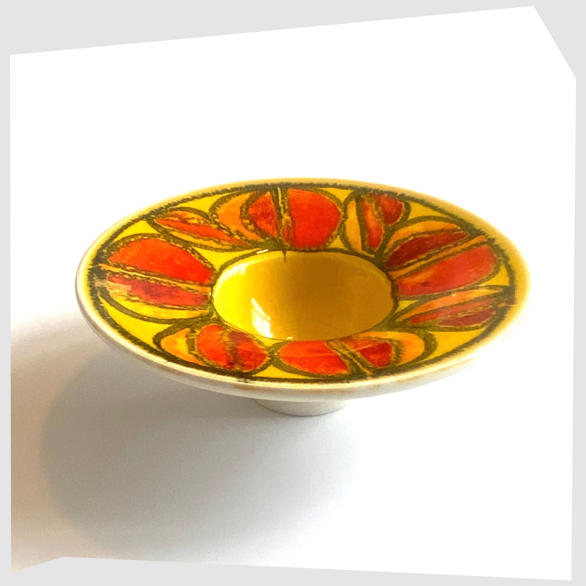 vintage poole pottery delphis candleholder in a vivid yellow glaze with circular forms of red and orange glaze