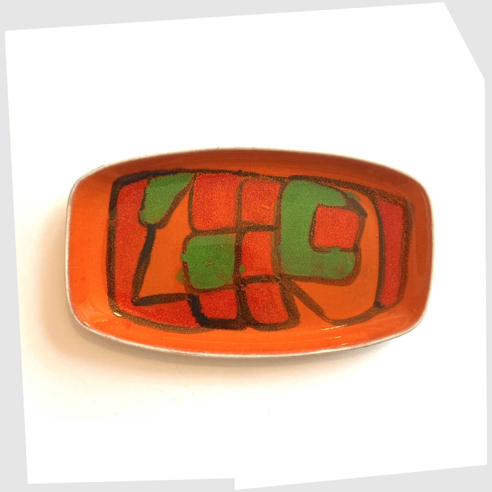 Poole Pottery Delphis Dish, Shape 61, by Gillian Taylor in a vivid orange glaze with forms of green and red, photographed on a white background