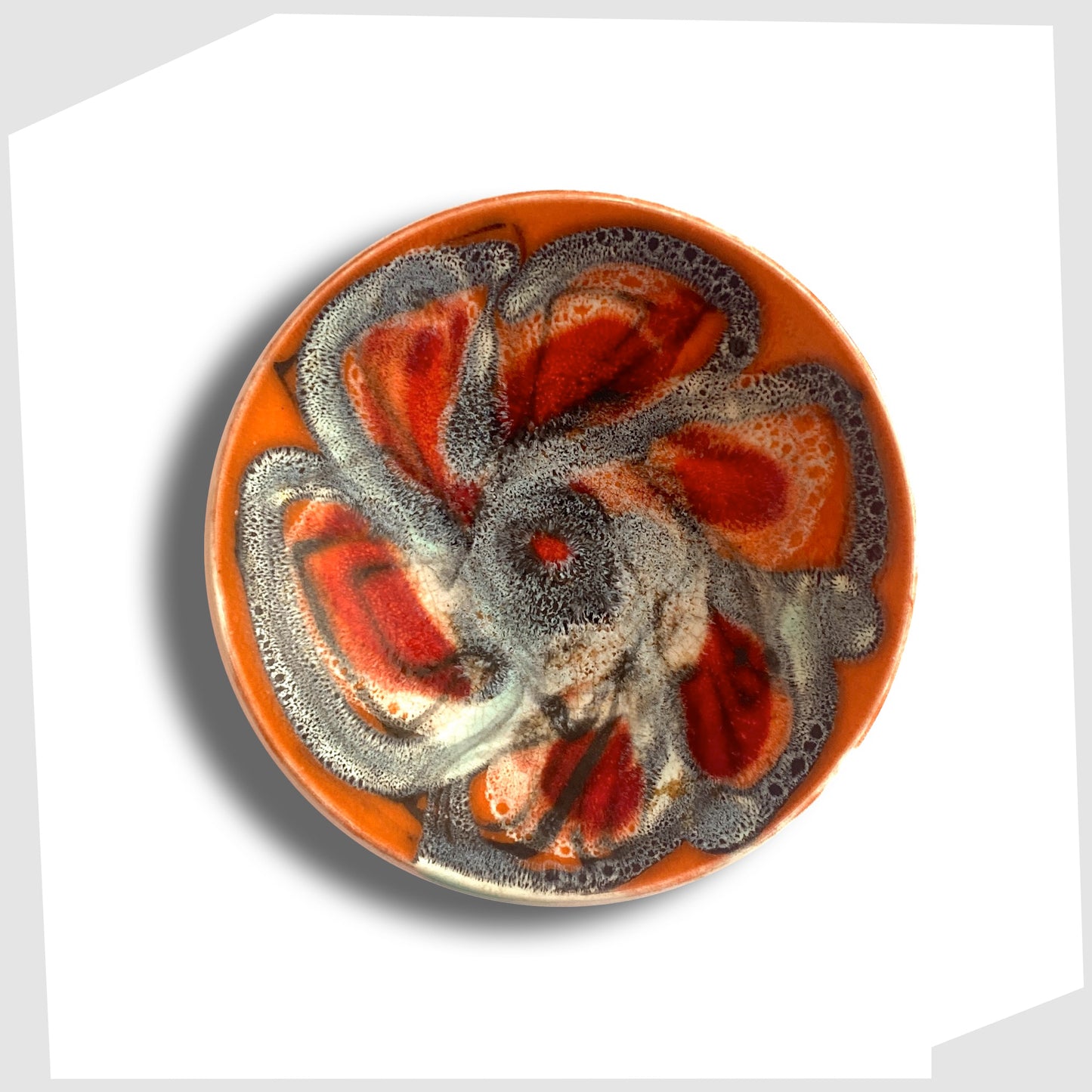 Poole Pottery Delphis Pin Dish by Jean Millership finished in a vibrant orange, blue and red glaze