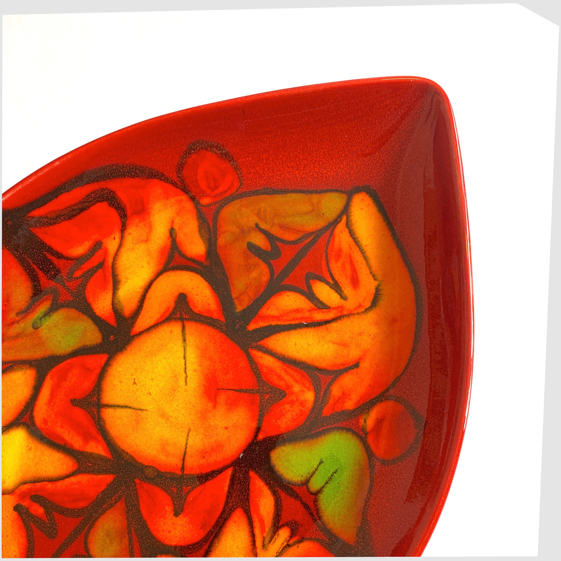 poole pottery teardrop dish, shape 91, in vivid red glaze with orange and green forms