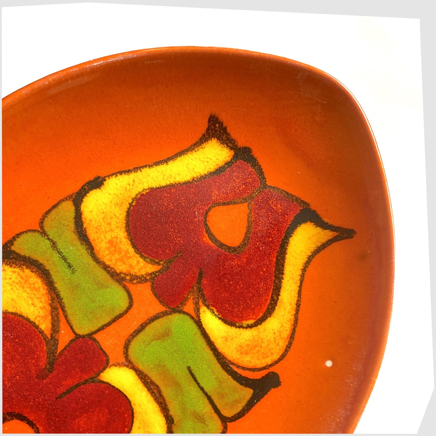 poole pottery teardrop shaped decorative dish, decorated in an orange delphis glaze