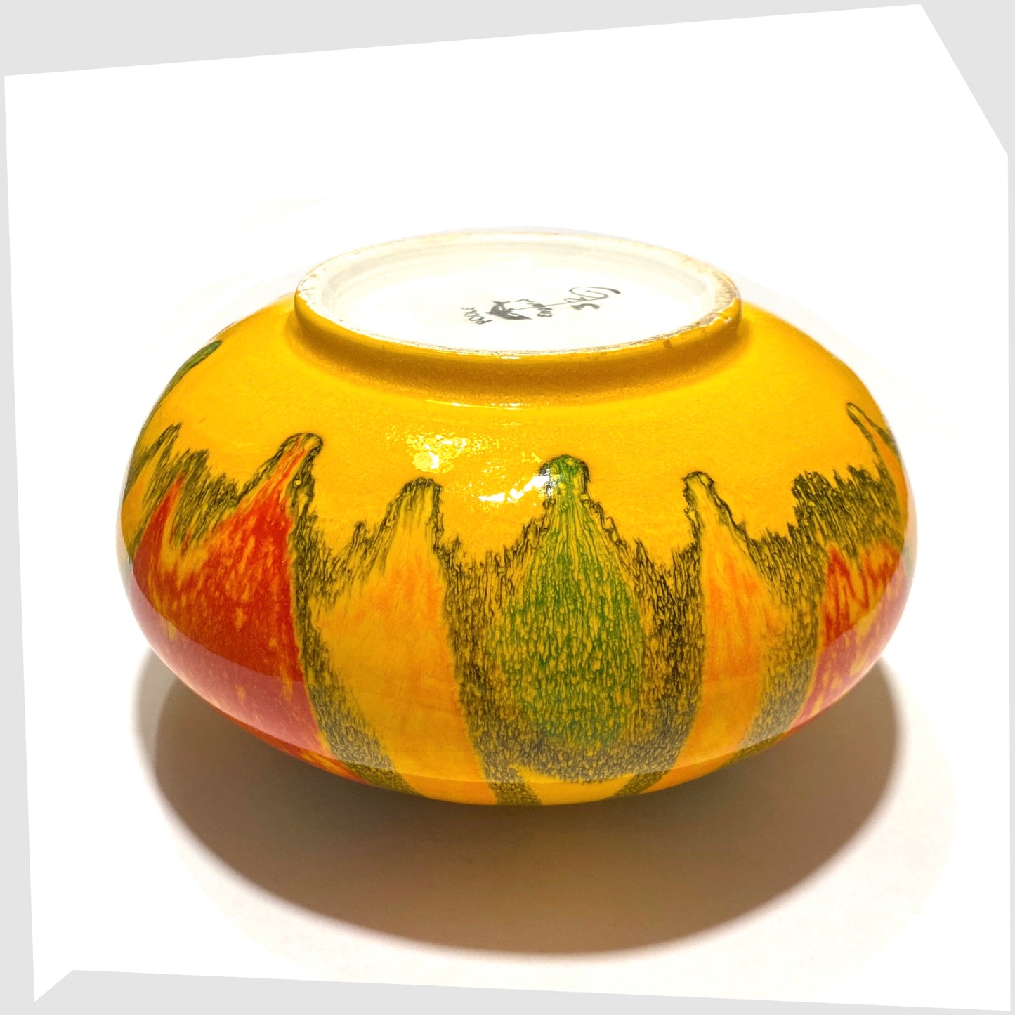 base of the Poole Pottery Onion Vase, Shape 32, by Gillian Taylor in a vivid yellow glaze with abstract forms of orange, red and green