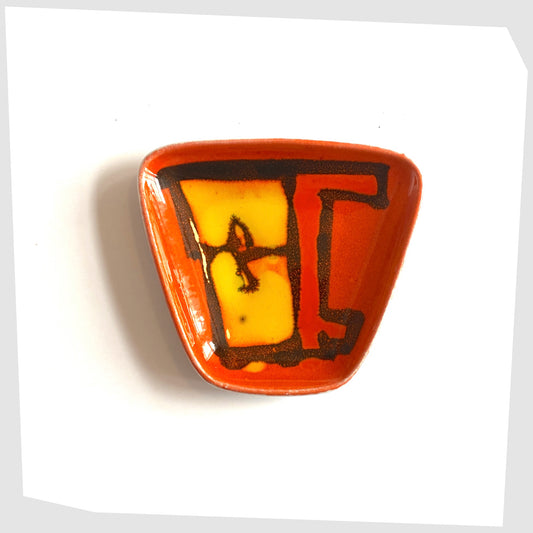 Poole Pottery Delphis Pin Dish by Carol Cutler finished in an orange glaze with artistic forms of red and yellow 