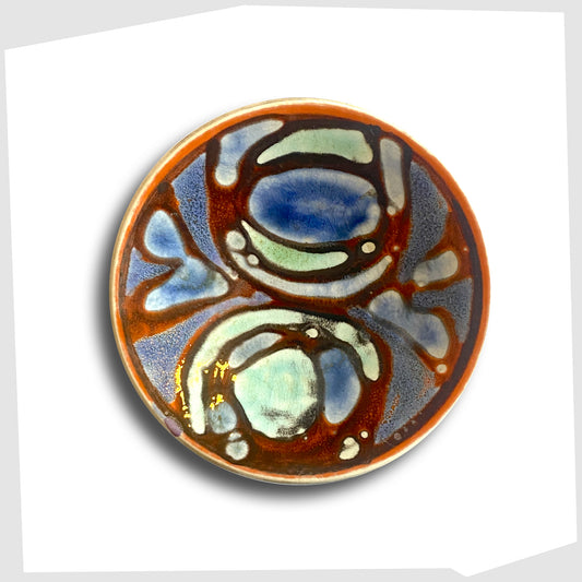 vintage poole pottery pin dish, shape 49, finished in a Delphis glaze of rich red with fluid forms of blue and turquoise