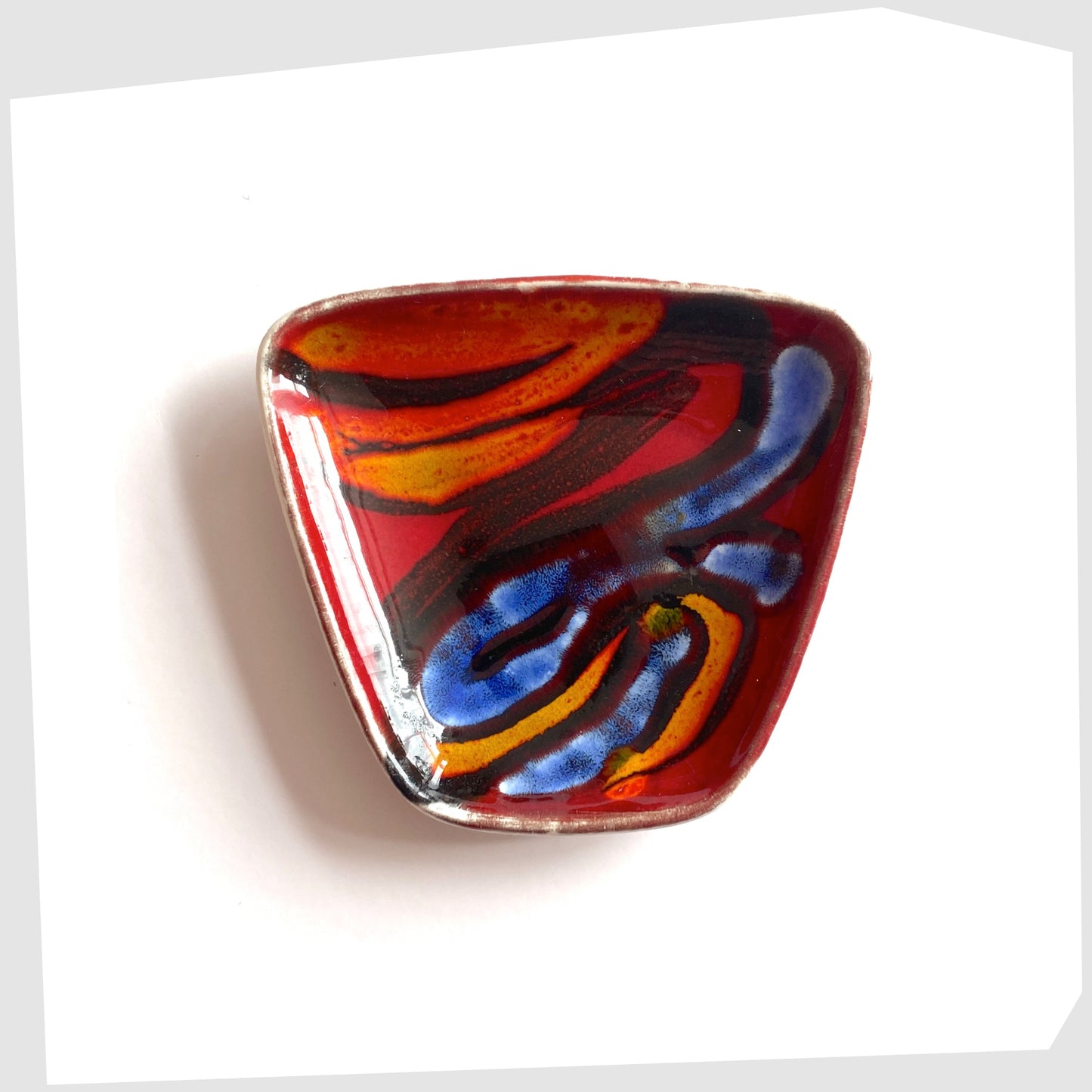 Poole Pottery Delphis Pin Dish, shape 41, by Loretta Leigh glazed in a rich red with fluid forms of blue, orange and yellow