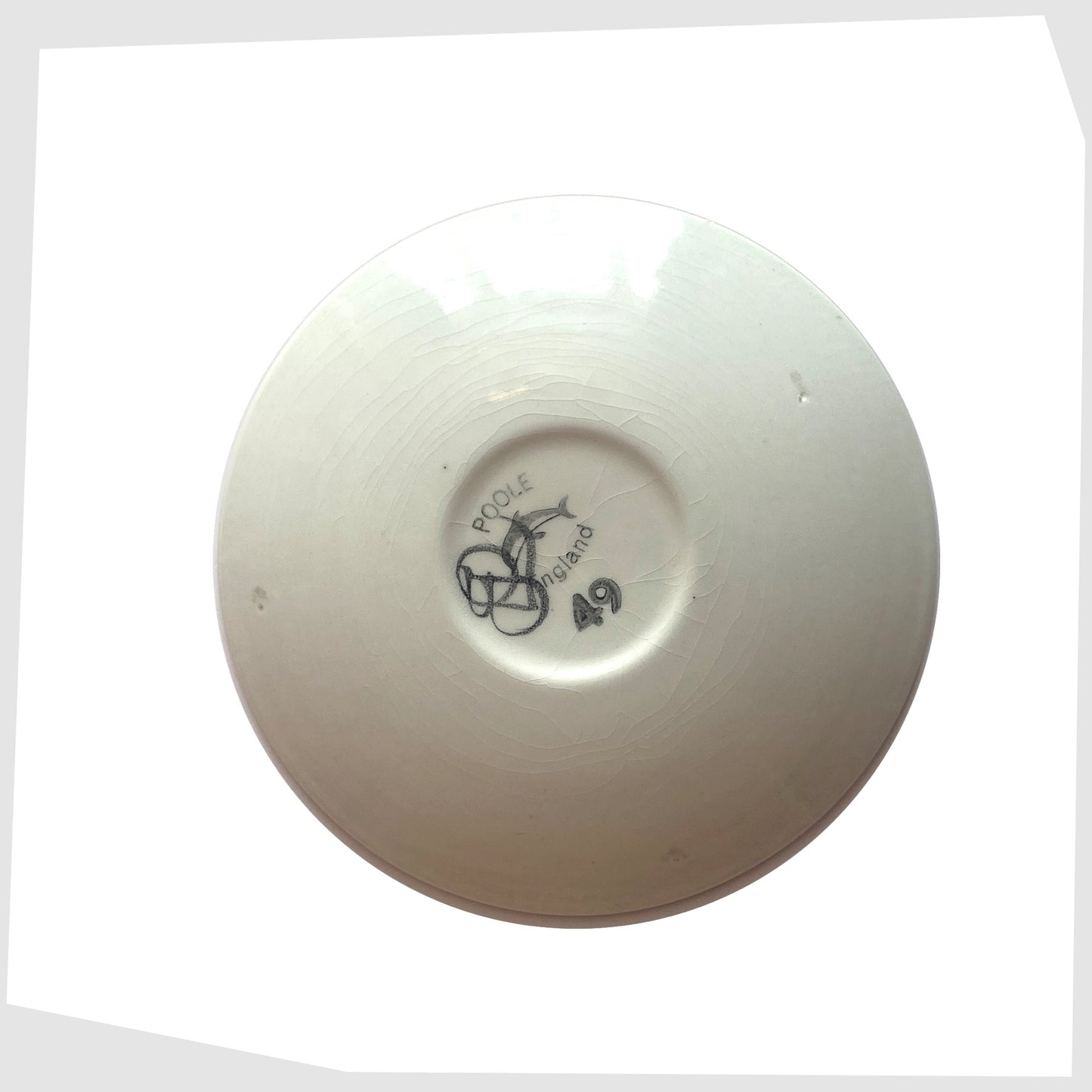 Rear of the Poole Pottery Delphis Pin Dish by Janet Laird, with the dolphin logo and artist signature, shown on a white background