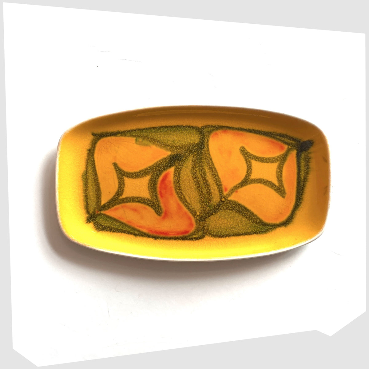 Poole Pottery Delphis Pin Dish, Shape 361, by Lynn Gregory in a vibrant yellow glaze with free-form shapes of orange and green, shown on a white background