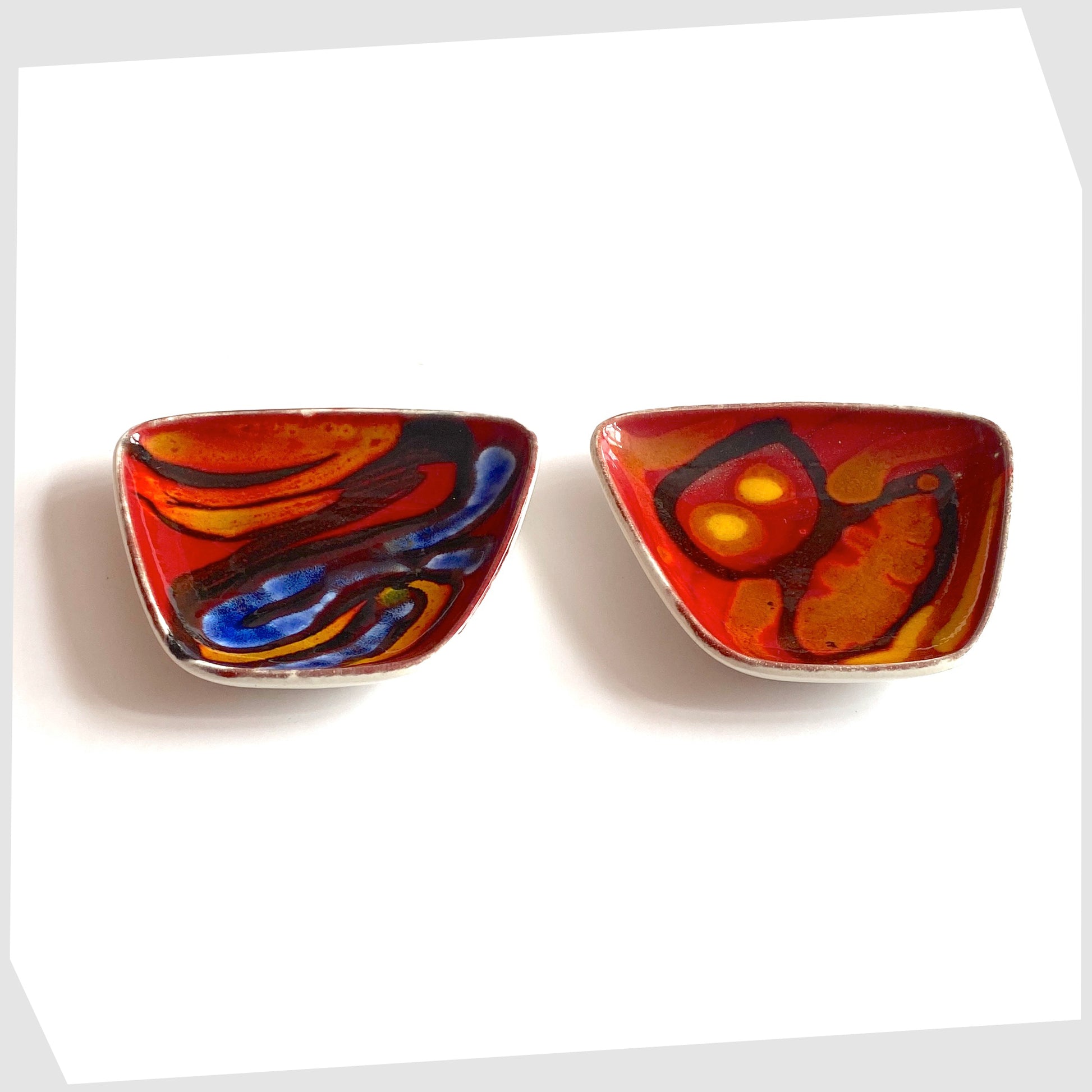 2 x Poole Pottery Delphis Pin Dish, shape 41, by Loretta Leigh glazed in a rich red with fluid forms of blue, orange and yellow