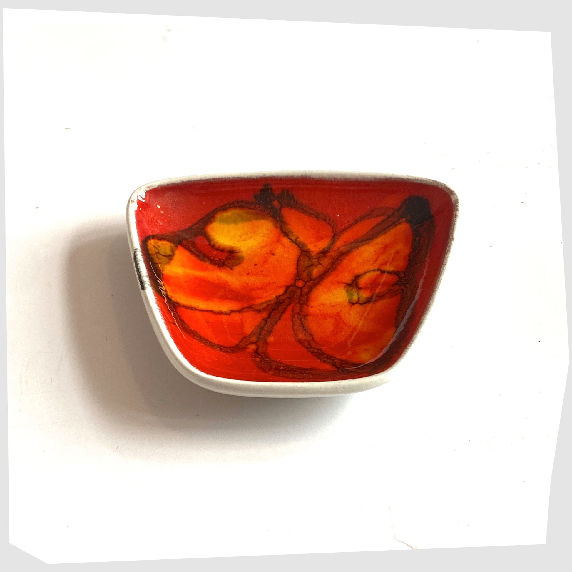 Vintage Poole Pottery Delphis Pin Dish by Anita Lawrence in a red glaze with orange and yellow shapes