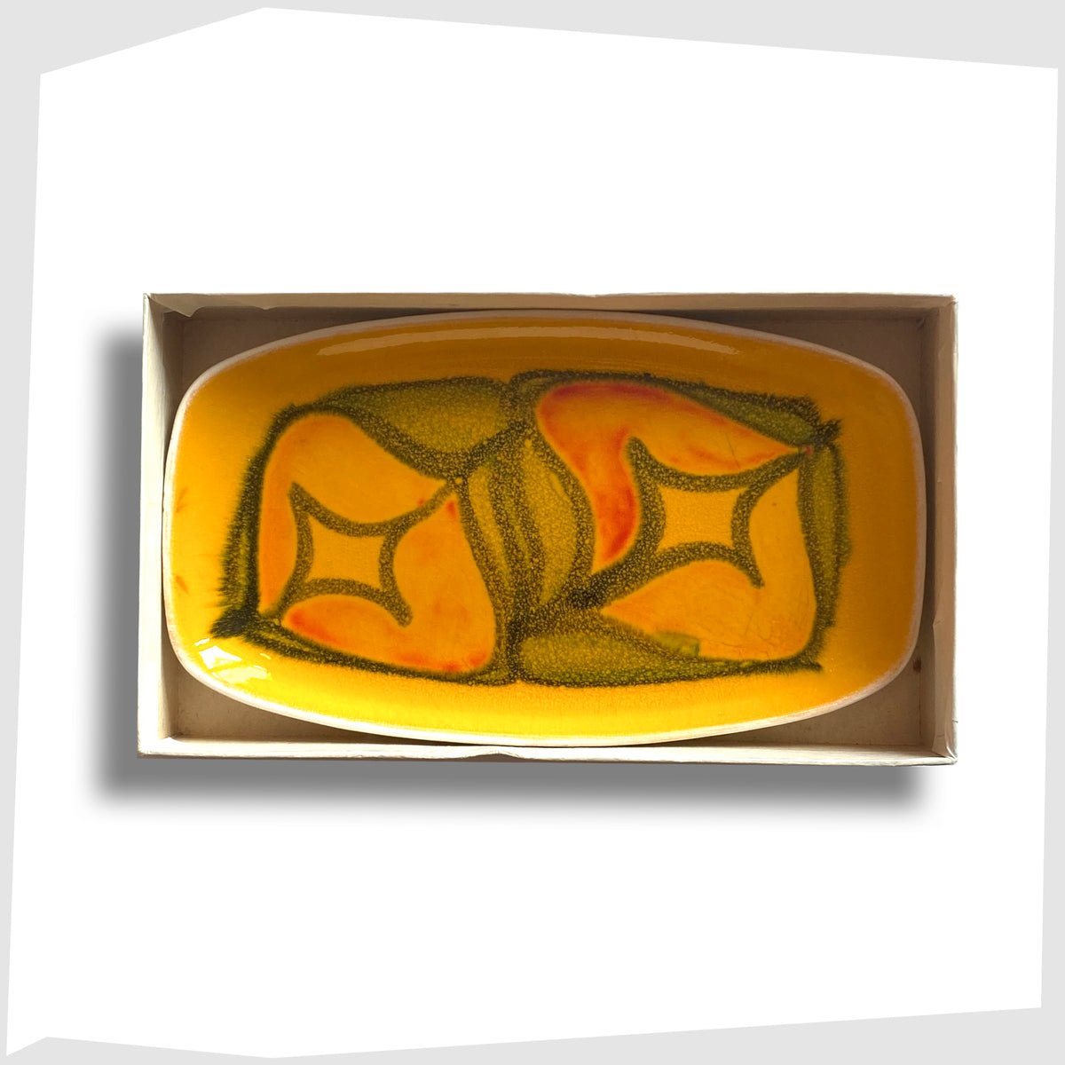 1970s Poole Pottery Delphis Pin Dish, Shape 361, by Lynn Gregory in a vibrant yellow glaze with free-form shapes of orange and green, shown on a white background
