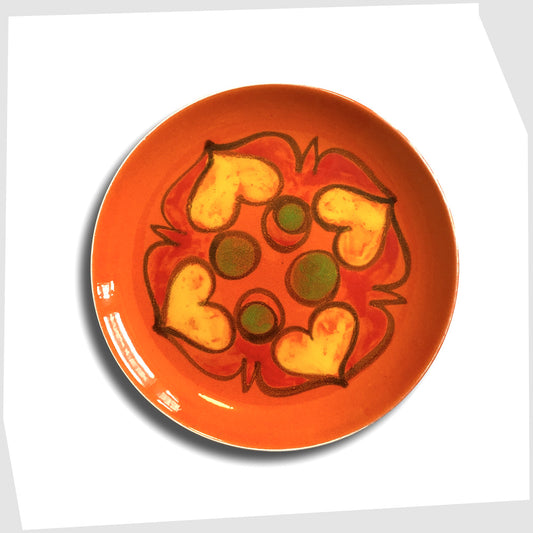 vintage poole pottery plate in orange Delphis glaze with flowing forms or red, yellow and green