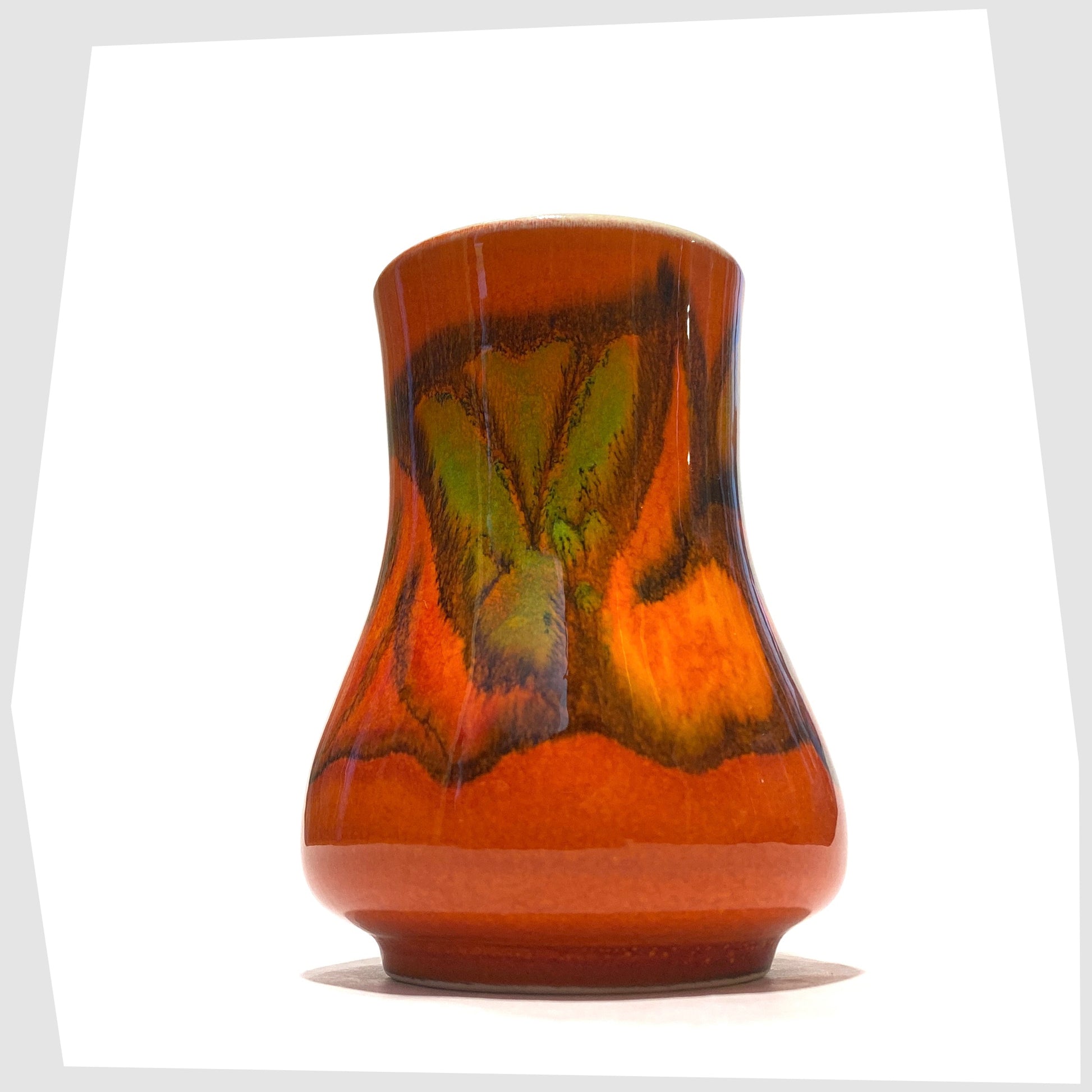 late 1970s Poole Pottery Delphis Vase, Shape 31, by Tina Fancy- glazed in a rich burnt orange with fluid forms of yellow, green and red, shown on a white background
