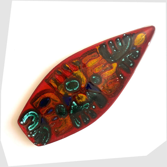 Poole Pottery Delphis Spear Dish, Shape 82, by paintress Irene Kerton finished in a vibrant red glaze with fluid forms of orange and turquoise, shown on a white background