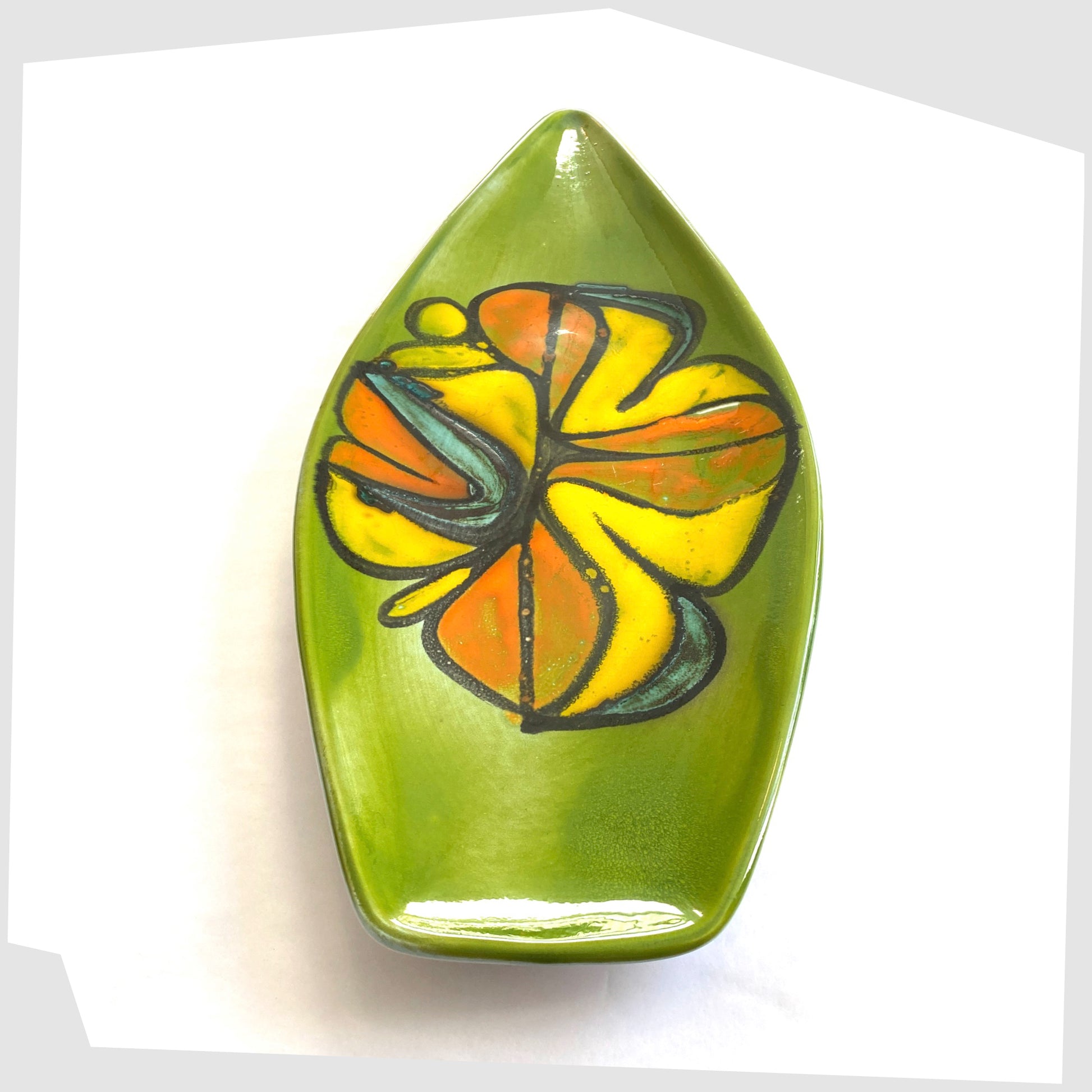 side profile of the poole pottery delphis spear dish, shape 82 by Cynthia Bennett, in a rich green laze with free-forms shapes of orange and yellow