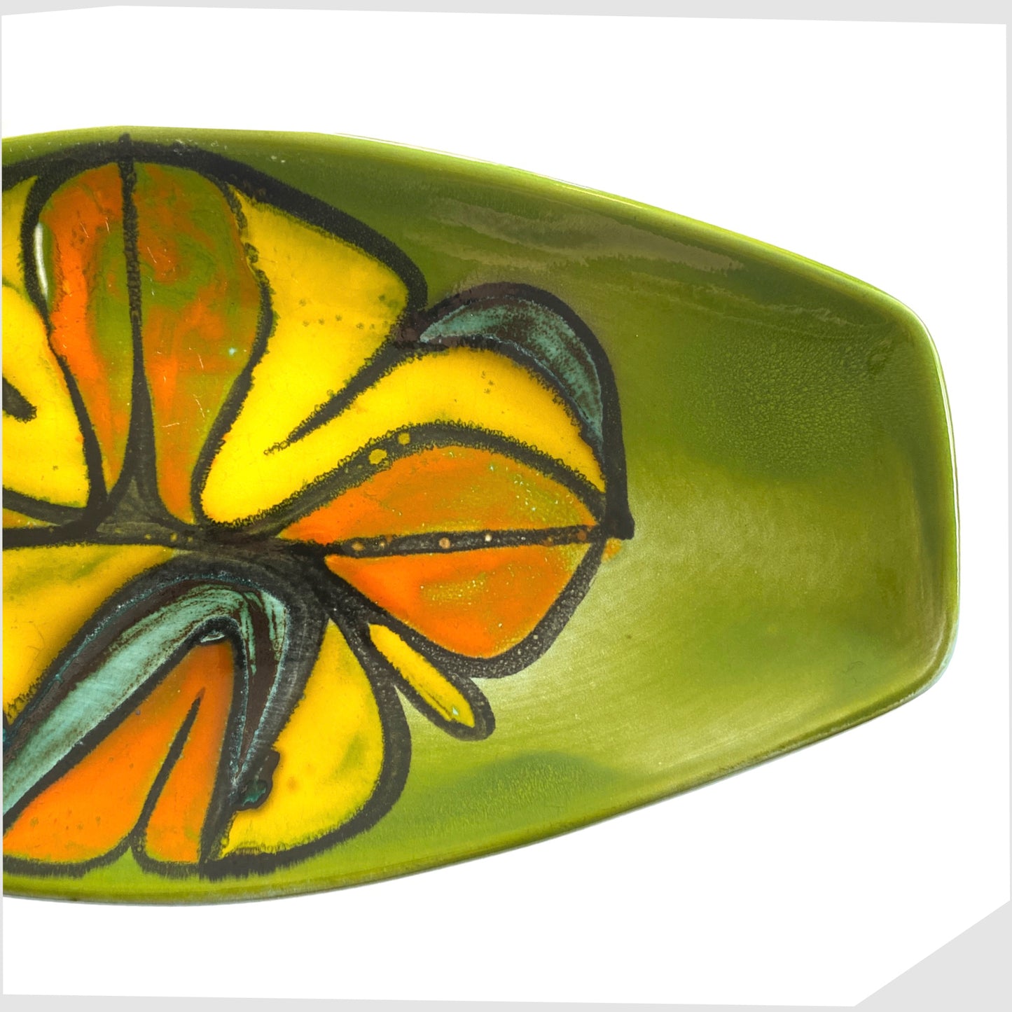 end of the poole pottery delphis spear dish, shape 82 by Cynthia Bennett, in a rich green laze with free-forms shapes of orange and yellow