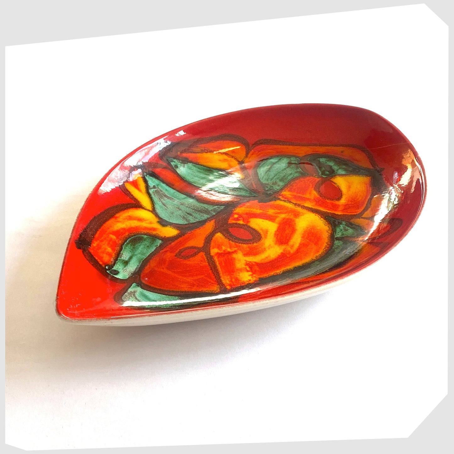 vintage Poole Pottery Delphis Teardrop Dish, shape 91, decorated by Angela Wyburgh, in a red glaze with green and orange forms