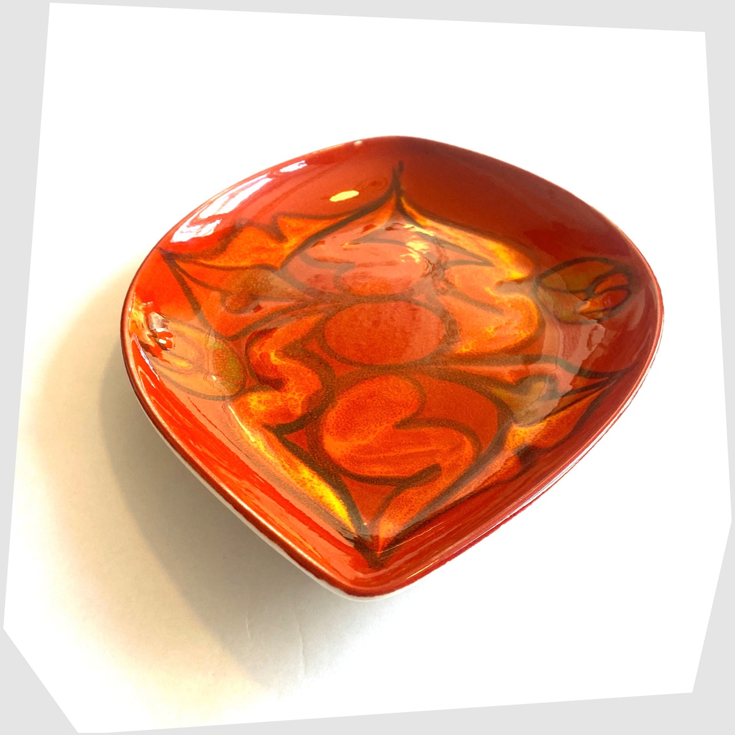 poole pottery teardrop dish finished in a red delphis glaze with orange and green fluid forms, by paintress Elaine Martin
