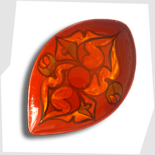 poole pottery teardrop dish finished in a red delphis glaze with orange and green fluid forms