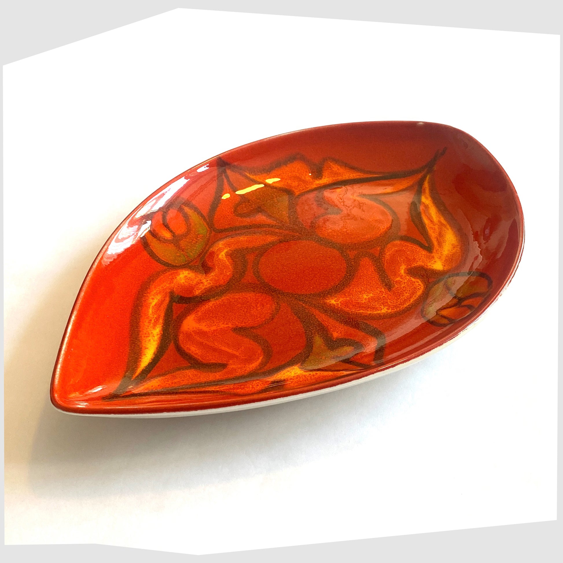 poole pottery teardrop dish by Elaine Martin finished in a red delphis glaze with orange and green fluid forms