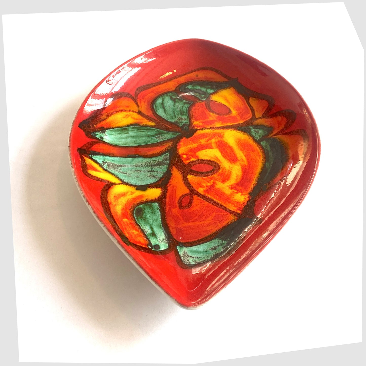 Poole Pottery Delphis Teardrop-Shaped Dish, shape 91, decorated by Angela Wyburgh, in a red glaze with green and orange forms