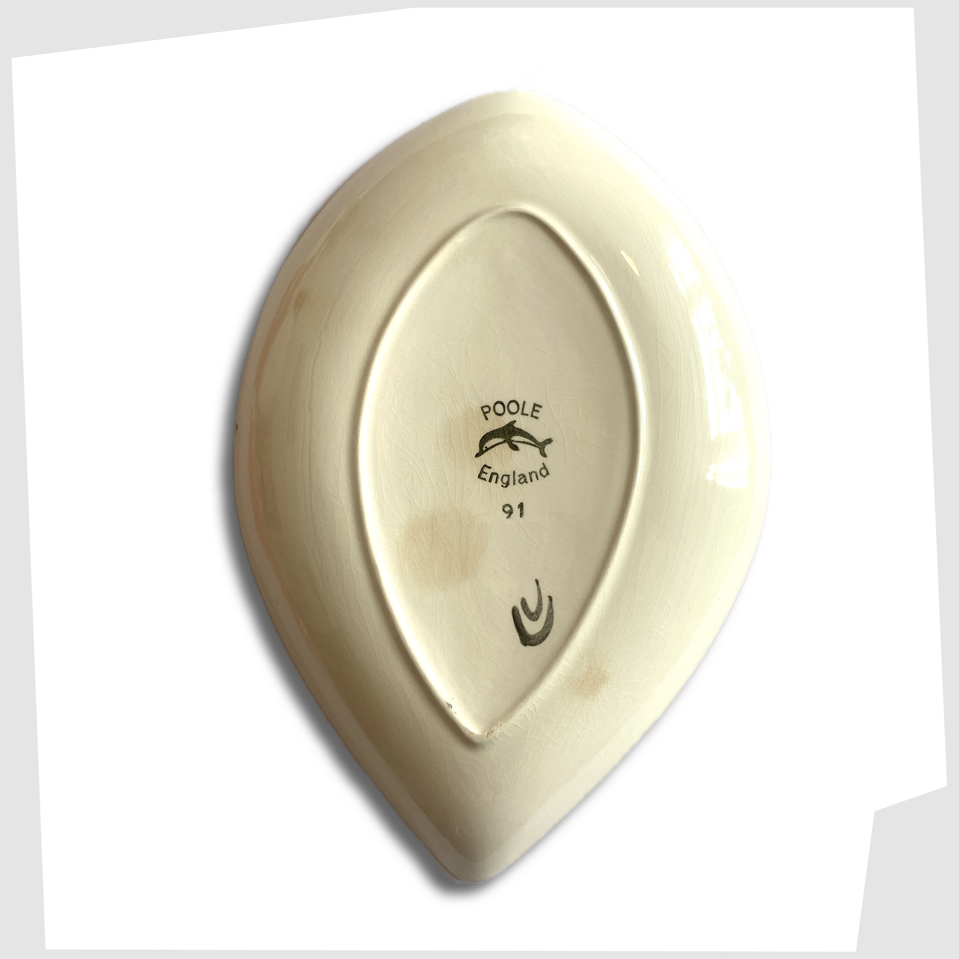 rear of the poole pottery delphis teardrop dish, shape 91, designed by Carol Cutler. 
