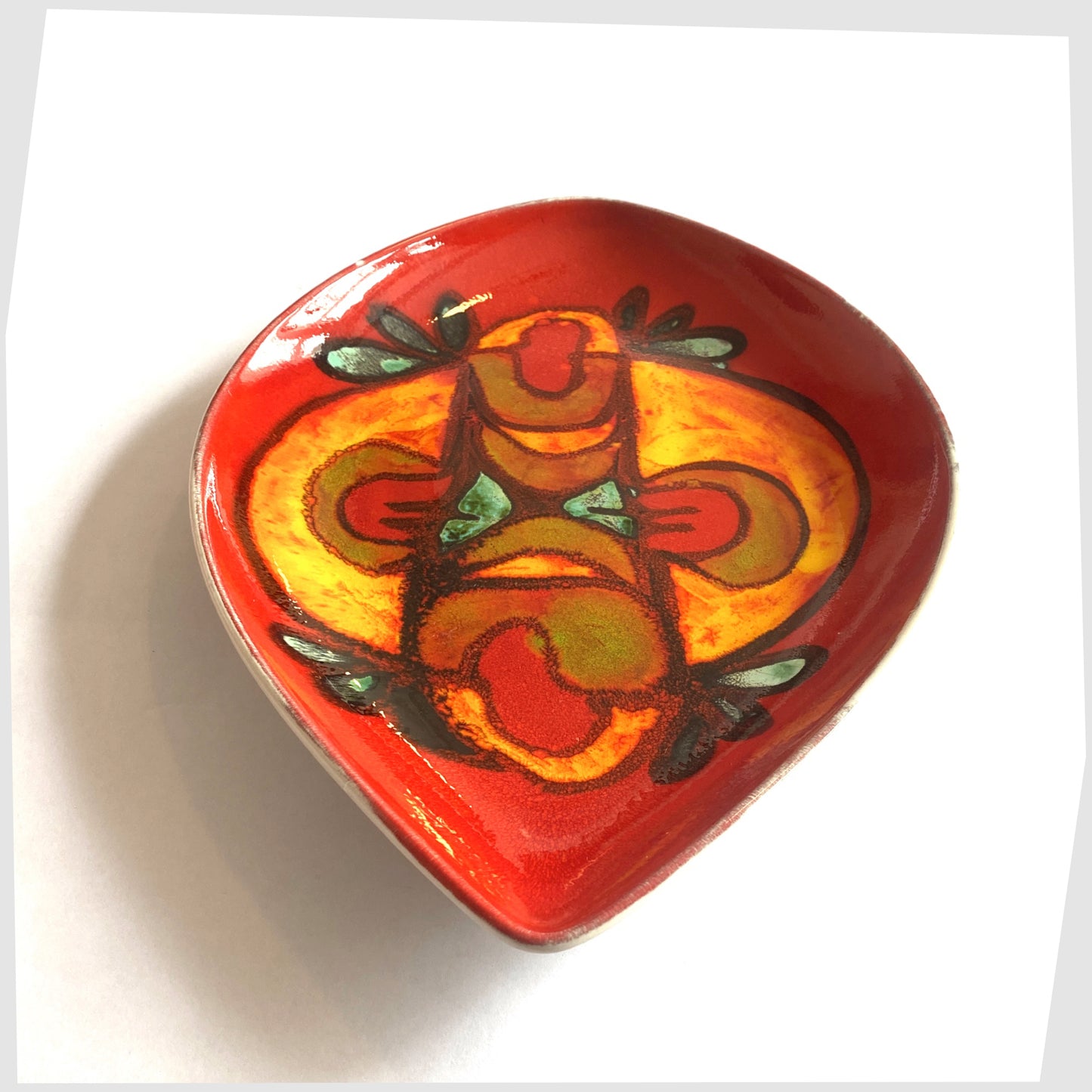 mid-century modern poole pottery delphis teardrop dish by andree fontana, glazed in a rich red with fluid forms of orange and green