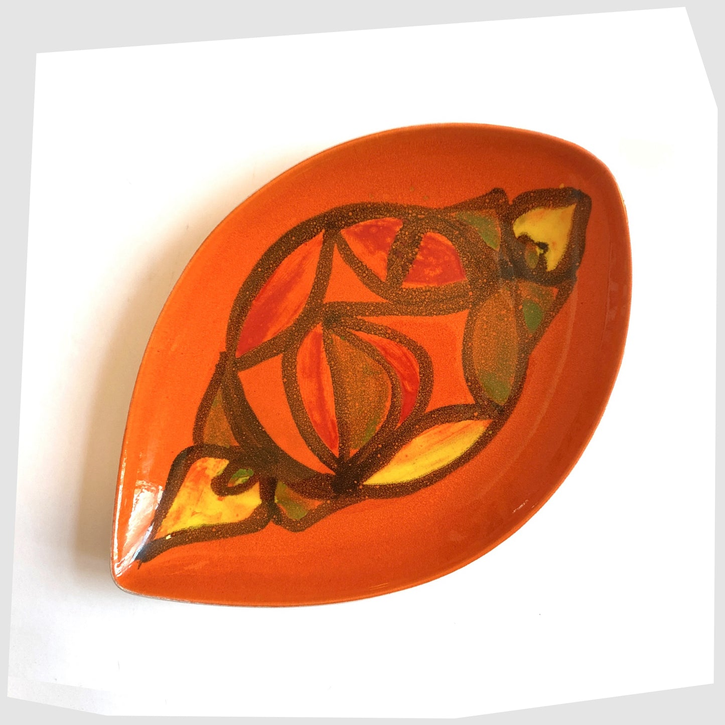 Poole Pottery Delphis Teardrop Dish by Anita Lawrence in an orange glaze with fluid forms of red, yellow and green