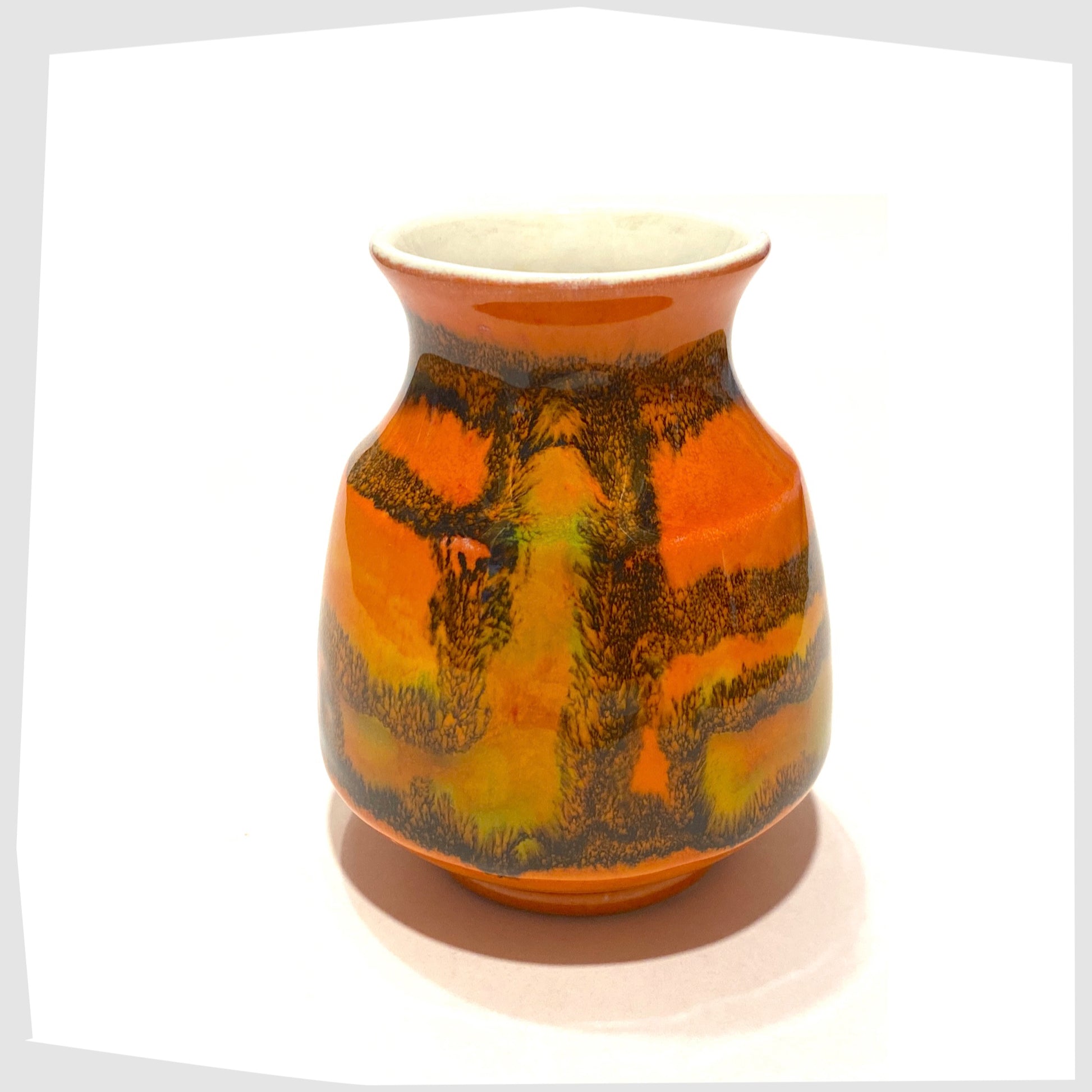 small Poole Pottery Delphis Vase, shape 31, by Carol Cutler in a vibrant orange glaze with geometric forms of yellow and green