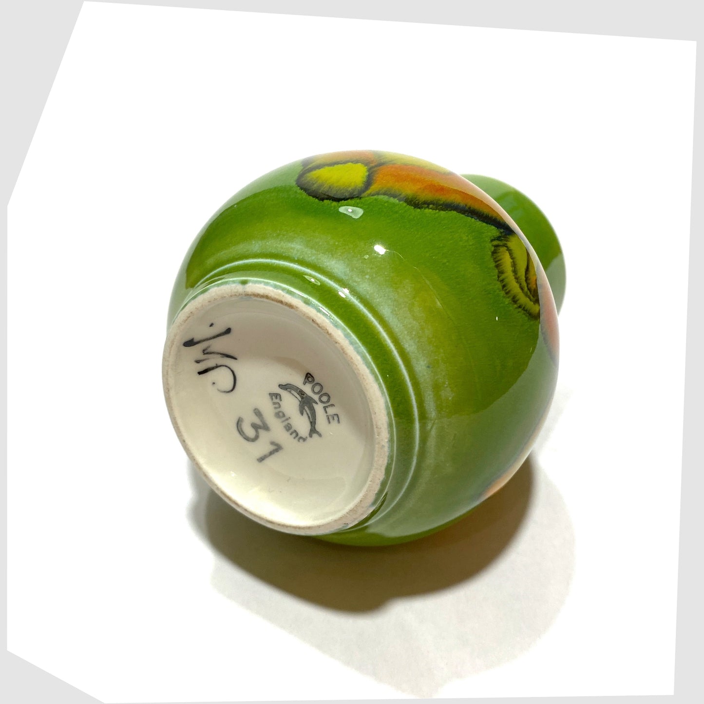 base markings on the vintage poole pottery vase, shape 31 by Julia Wills, finished in a green delphis glaze with yellow and orange forms